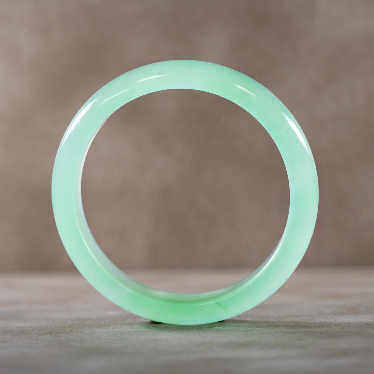 Enairo Light Green Jade Bangle

This versatile bangle is carved in elegant ice green nephrite  jade stone. 

Jade is the symbol of tranquility and purity. It conveys balance and increases the harmony between body and mind. It's a protective stone