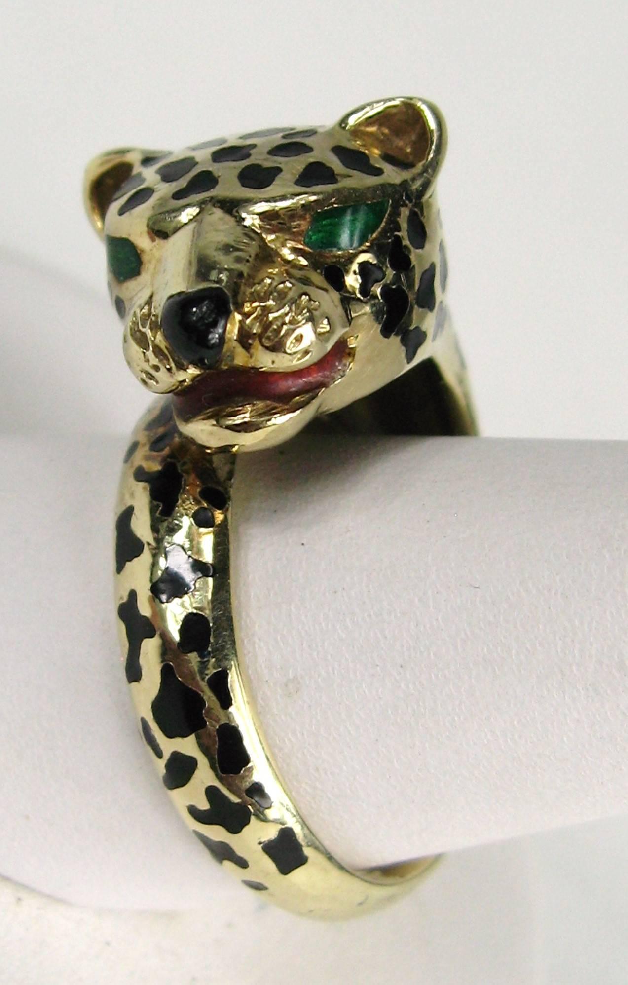 14K gold leopard head that wraps around your finger. Enamel spots and eyes. Hallmarked HM 14K inside the shank. The ring is a size 6.75 and can be sized up or down by us or your jeweler. This is out of a massive collection of Contemporary designer