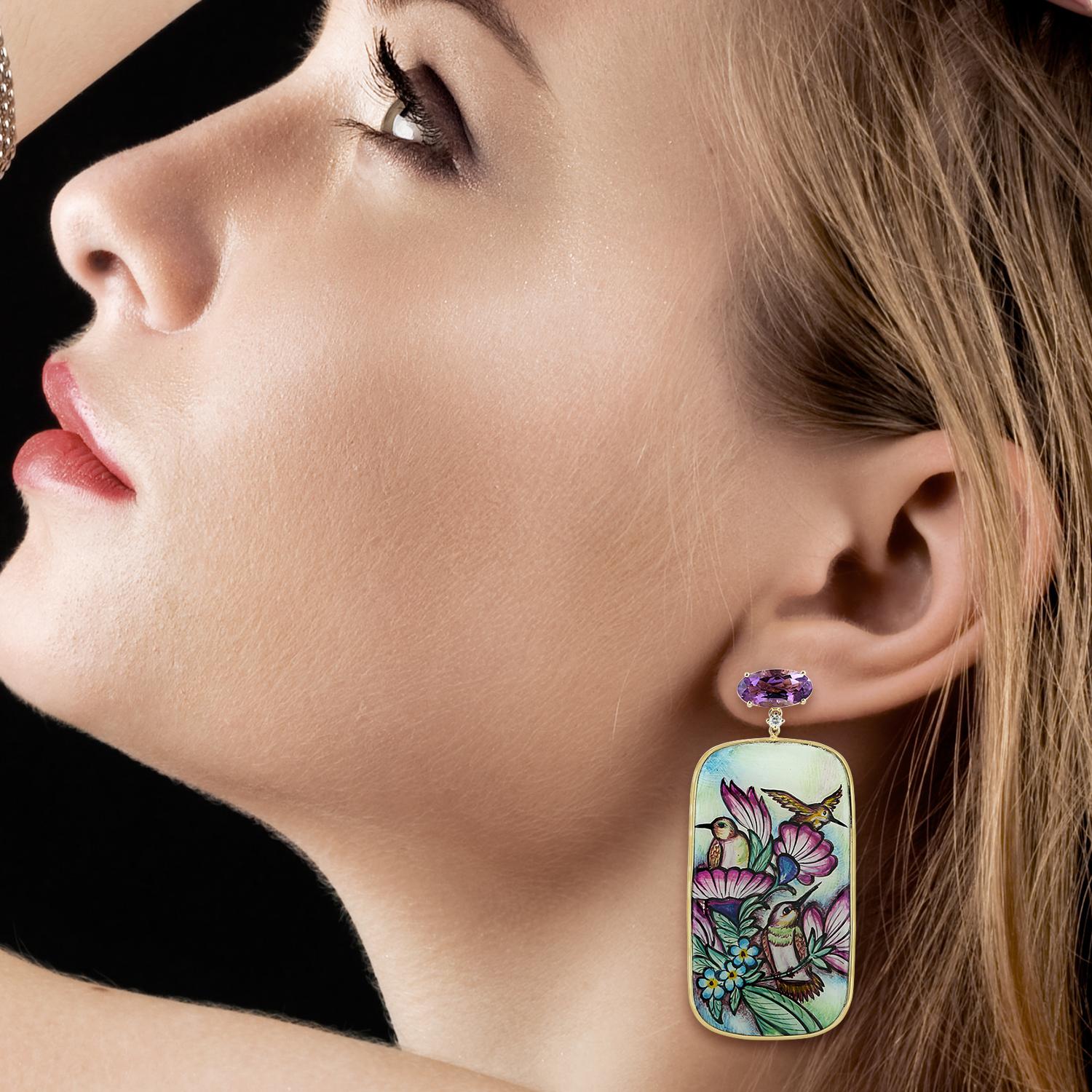 These beautiful bird earrings features unique hand painted miniature art cast in 18K gold.  It is set in 59.75 carats pearl, 6.1 carats amethyst & 0.13 carats diamonds.

FOLLOW  MEGHNA JEWELS storefront to view the latest collection & exclusive