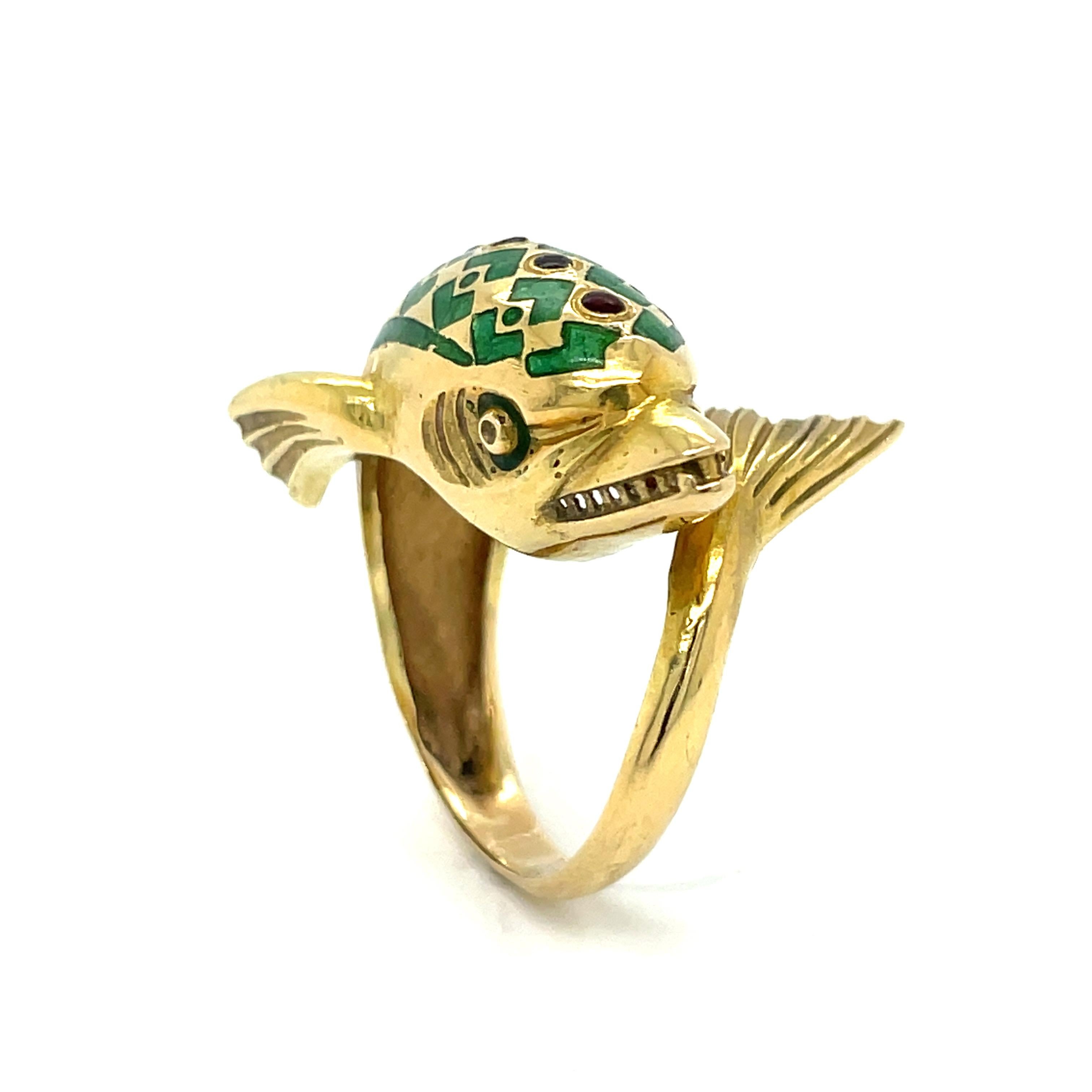 This magnificent vintage dolphin ring is a stunning one of a kind must have for dolphin lovers. Featuring vibrant green enamel and 7.40 grams of 18k yellow gold. 
This ring is a size 6.25 US and can be sized.  

This ring is sold in estate condition
