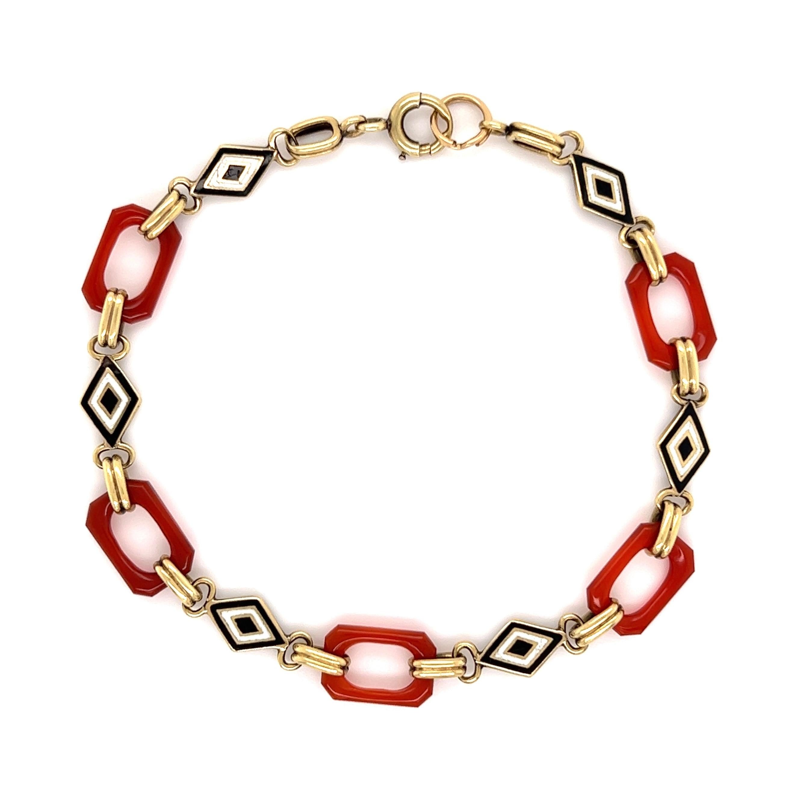 Simply Beautiful! Classic and Chic Carnelian and Enamel Hand crafted 18K Yellow Gold Link Bracelet. Each open link inter-spaced with Carnelian Links and Enamel Medallions. Bracelet measures approx. 7.5” long. A sure to be admired perfect complement