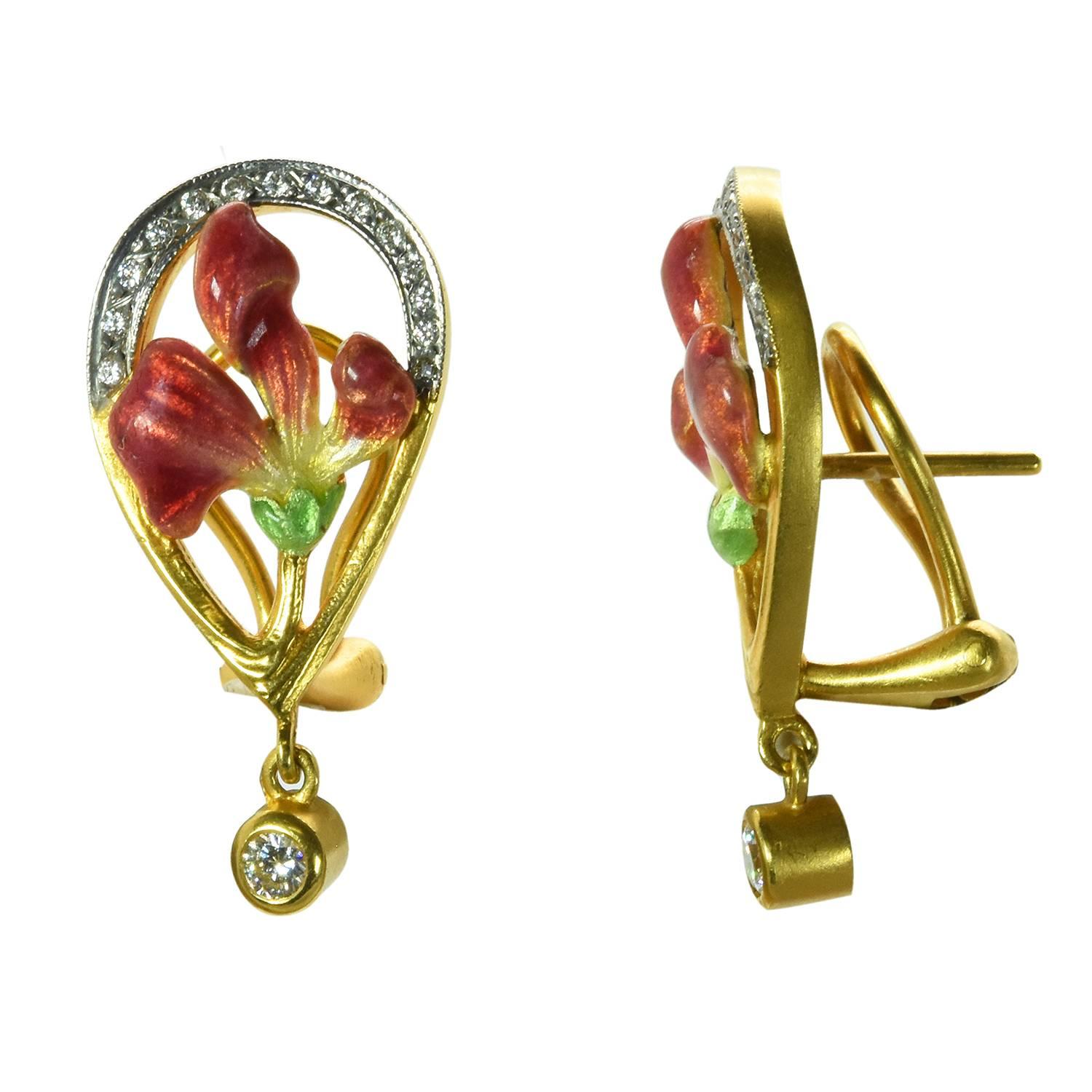 A pair of pink and green enamel and diamond earrings by Masriera. The Earrings feature two bezel-set diamonds totaling approximately 0.20 carats and 28 round brilliant diamonds totaling approximately 0.15 carats. The earrings are made in 18k yellow