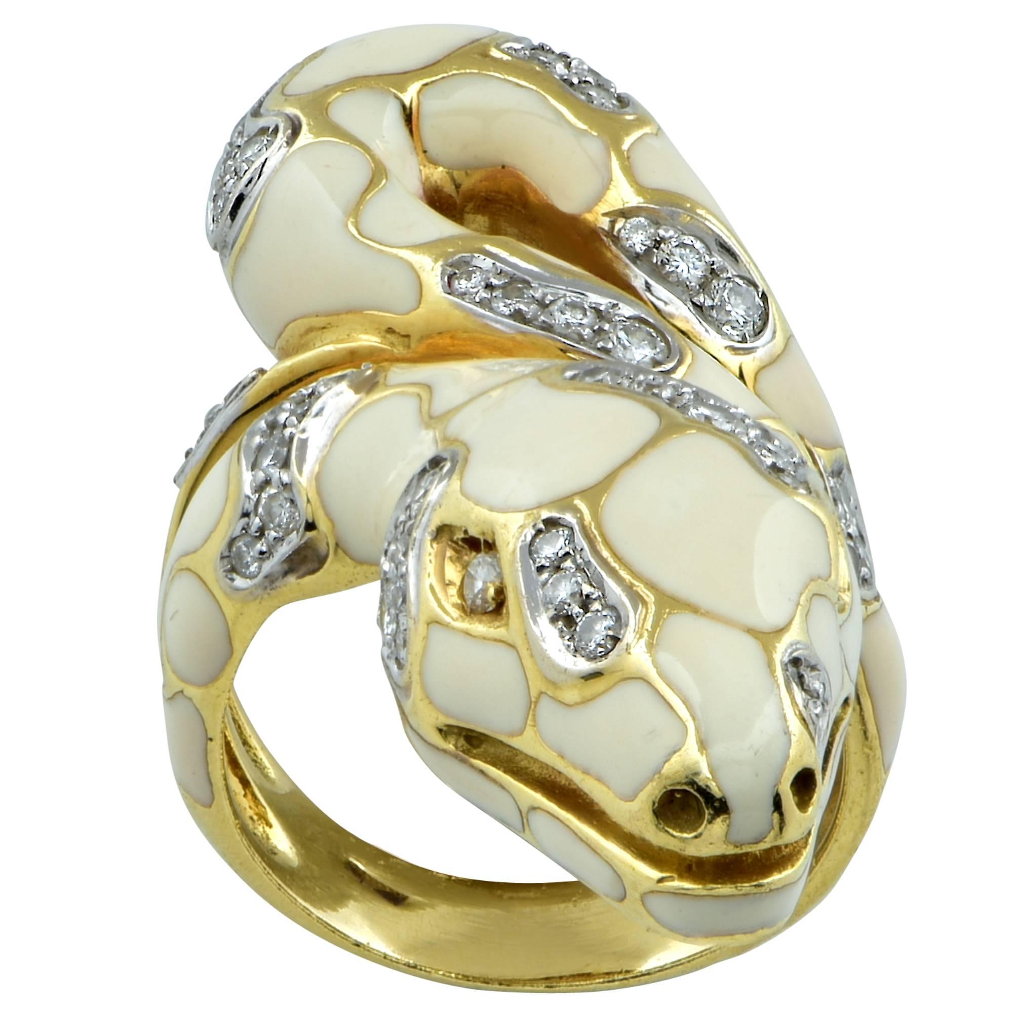 This sensational snake ring is crafted in 18k yellow gold and is enriched with cream colored enamel . The ring is further enhanced with diamond scales studded with 59 round brilliant cut diamonds weighing approximately .80 carats, G color, VS