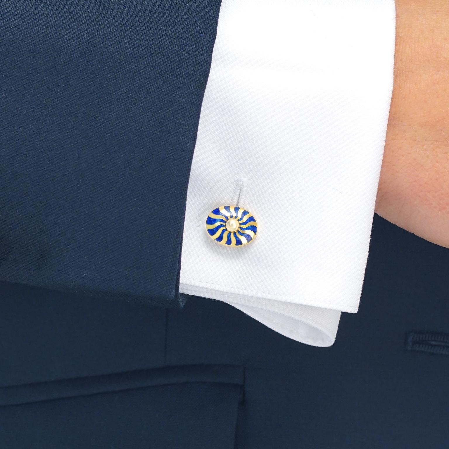 Circa 1980s, 18k, London.  These chic eighties cufflinks represent the best of vintage London style. Blue enamel sunbursts will tastefully add style and verve to any suit or jacket. Beautifully made, they are in good condition.

Remark: “Cufflinks