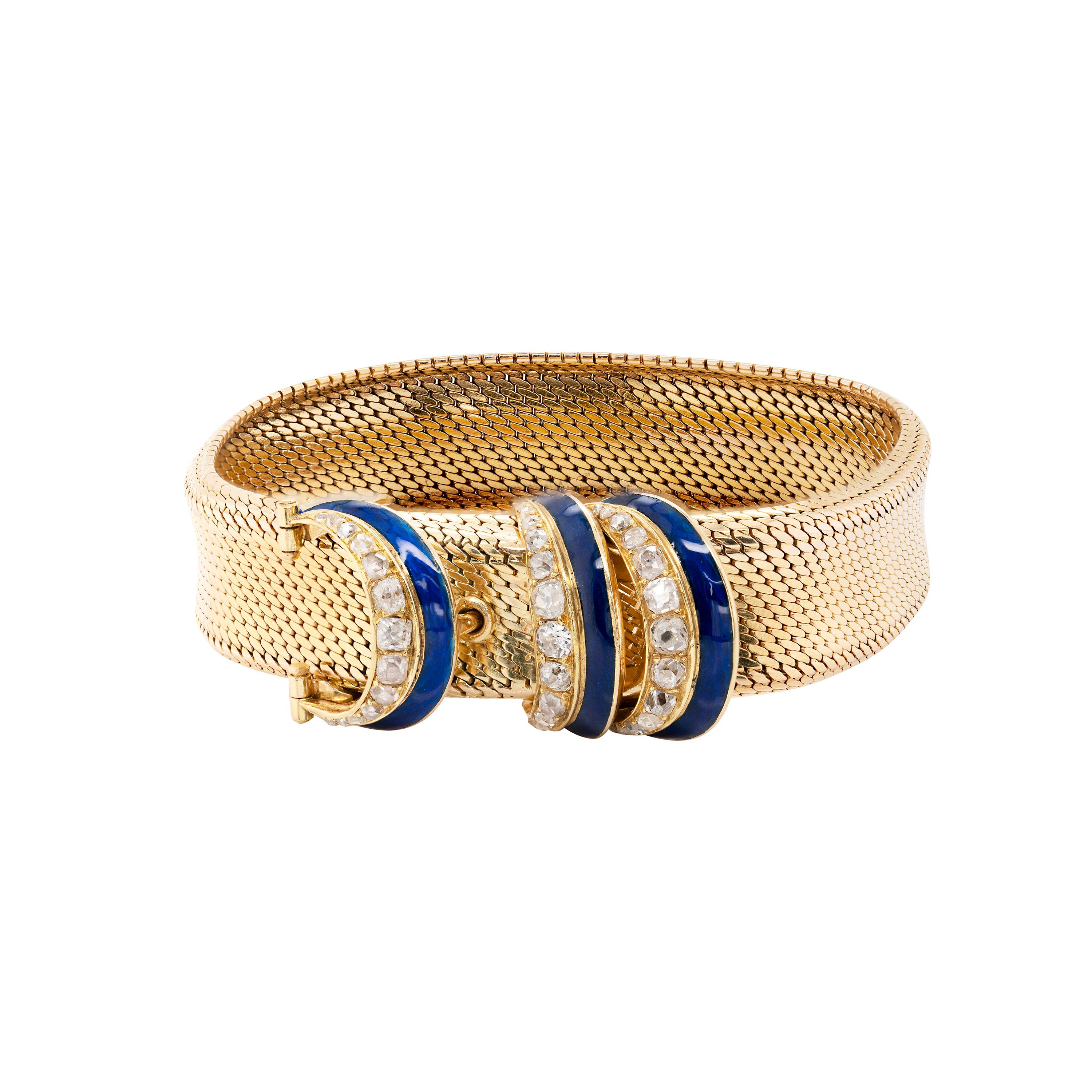Unique and spectacular, this antique piece is designed as a flexible mesh belt and buckle bracelet masterfully crafted from 18 carat yellow gold. The buckle fastening and the two loops fitted above it are each beautifully adorned with a row of