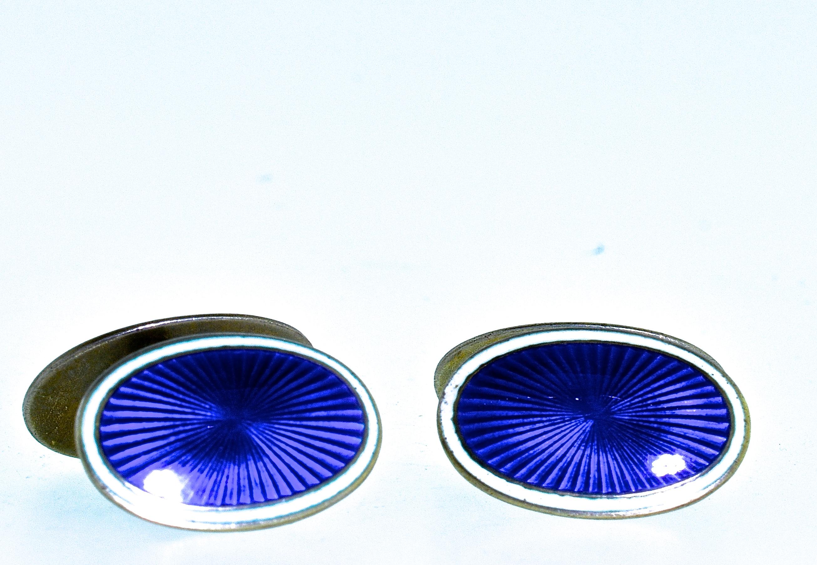 Enamel back to back Art Deco cufflinks  The guilloche enamel is a bright royal purple with white opaque enamel on the edges.  These back to back cufflinks are sterling, circa 1930,  For the ease of putting through the shirt, one side of cufflink