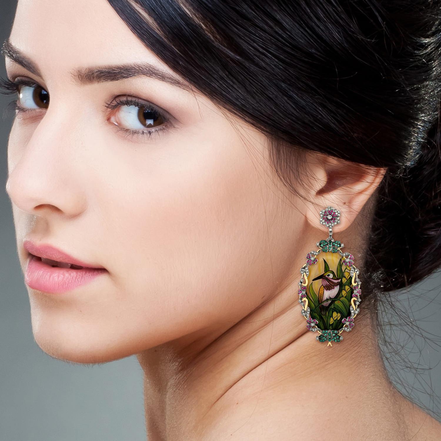 These beautiful bakelite bird earrings features unique hand painted miniature art set. Cast in 18-karat gold & sterling silver, these earrings are set with .66 carats emerald, ruby and 1.75 carats of sparkling diamonds. 

FOLLOW  MEGHNA JEWELS