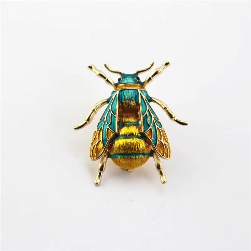 Simply Beautiful! Blue and Yellow Golden Enamel Bumblebee Brooch Pin. Gold tone mounting. Measuring approx. 1.4