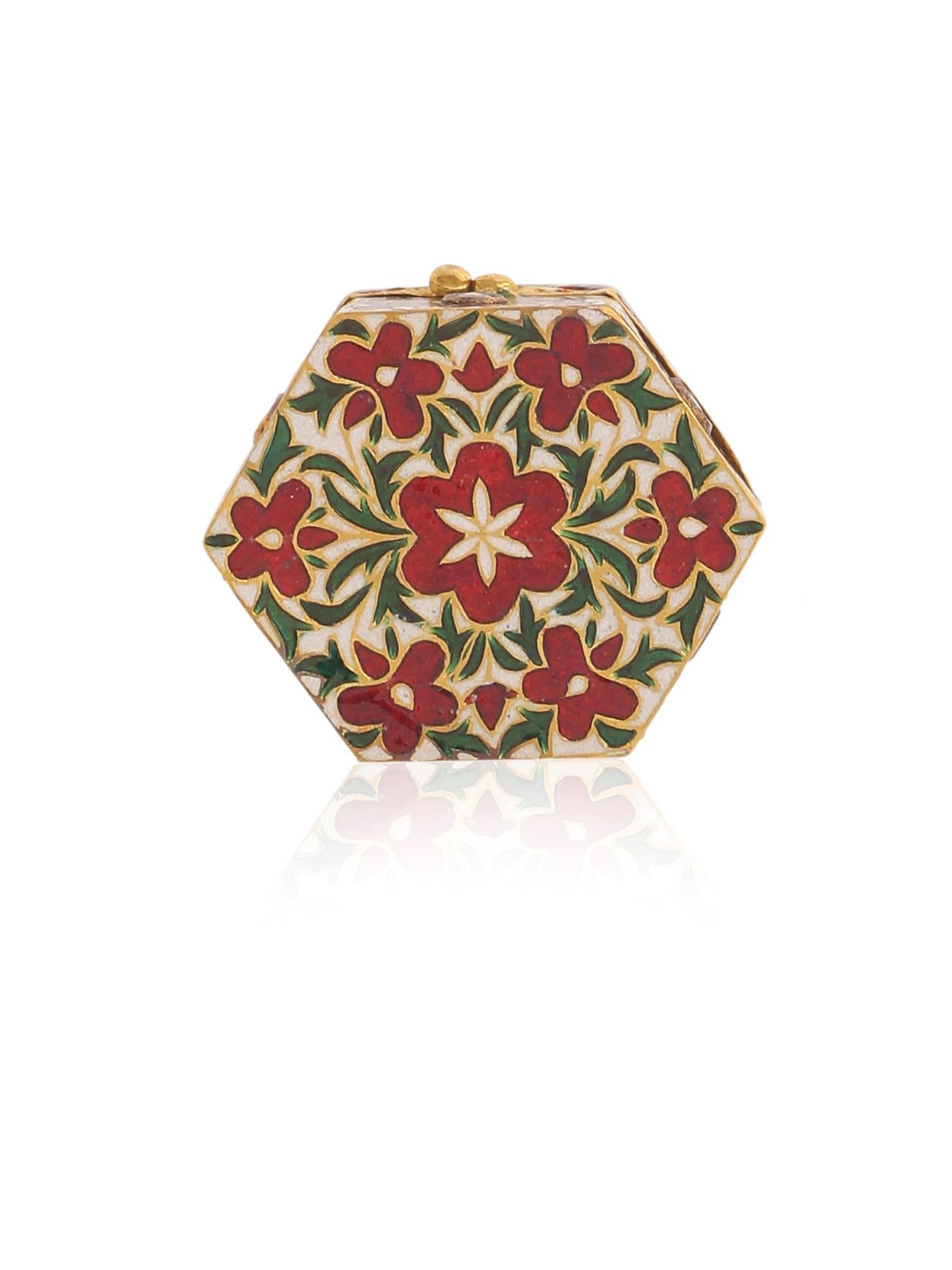 A beautiful box with fine enamel work studded with Diamonds and Rubies. Similar enamel work can be seen in Indian and Mughal jewellery from centuries ago. The work and art of enamelling is Called 