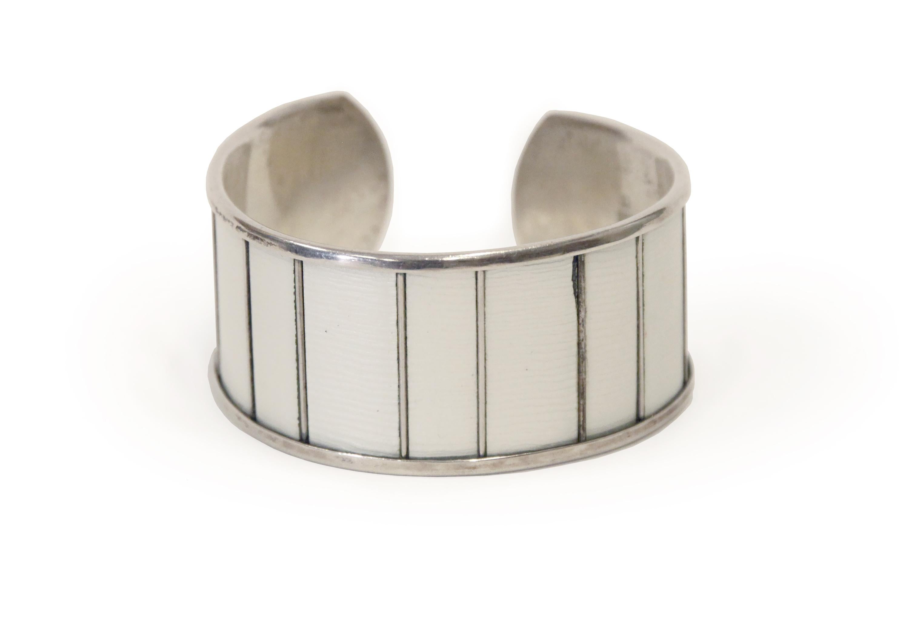 Sublime cuff bracelet in off-white enamel and silver. Designed by Grete Prytz Kittelsen for J. Tostrup from 1950s first half. The bracelet in is good vintage condition with a minor chip on the enamel (see picture). A very rare piece of Norwegian mid