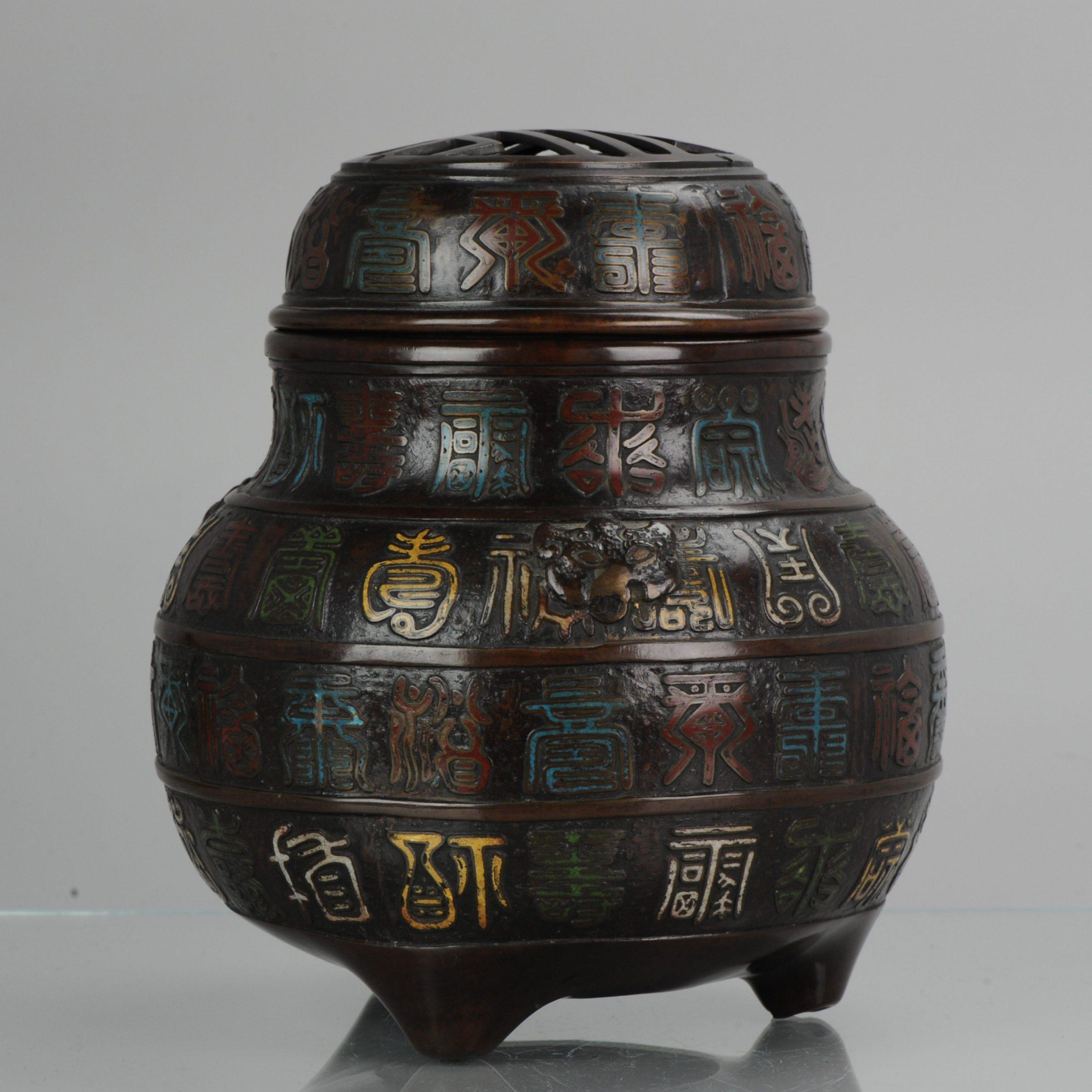 A tripod polychrome cloisonné incense burner, decorated with characters and masks. Unmarked, Japan, 19th century. Provenance: collection Nieuwenhove.

 

 

Condition
Overall condition Perfect. Size 270mm high approximate.
Period
18th