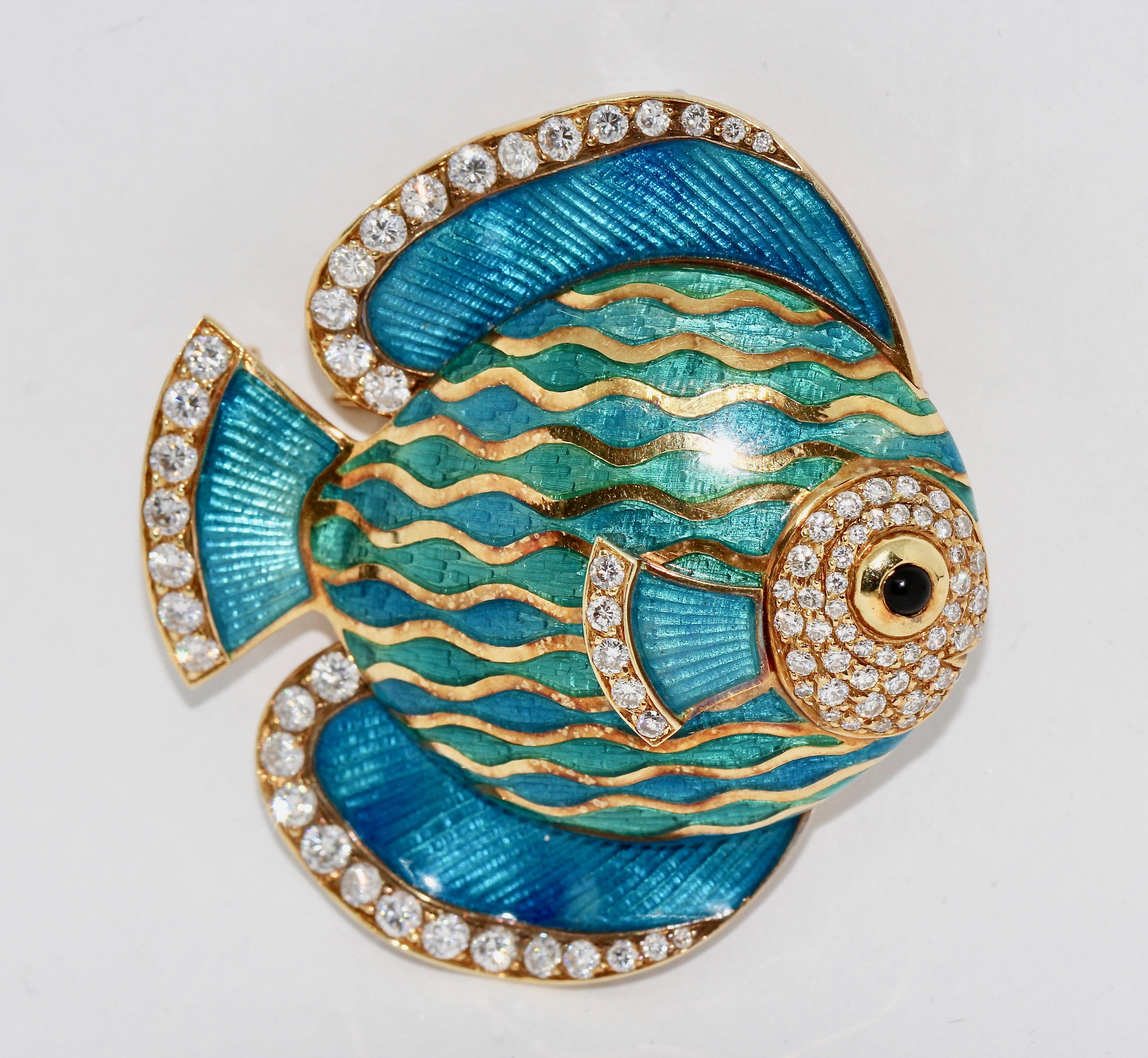 Beautiful and luxurious enamel brooch, pendant, (enhancer) as an exotic ornamental fish, 18 karat gold and diamonds.

Wearable as brooch or pendant.

The brilliants have a very good clarity and perfect white color.
The fish eye is kept as