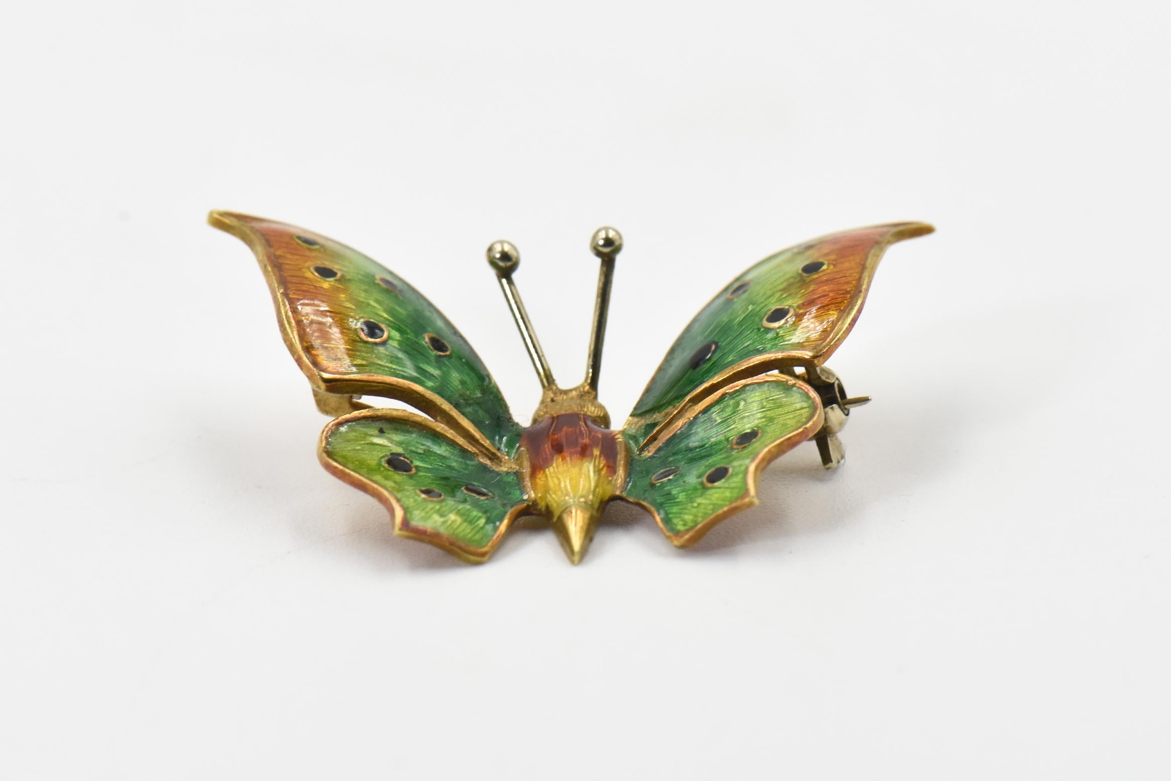 Italian beautifully made three dimensional butterfly brooch decorated in yellow, orange and green enamel.  The pin closure is a c - safety clasp.  The brooch is 18k yellow gold.  It is marked 18k Italy.  