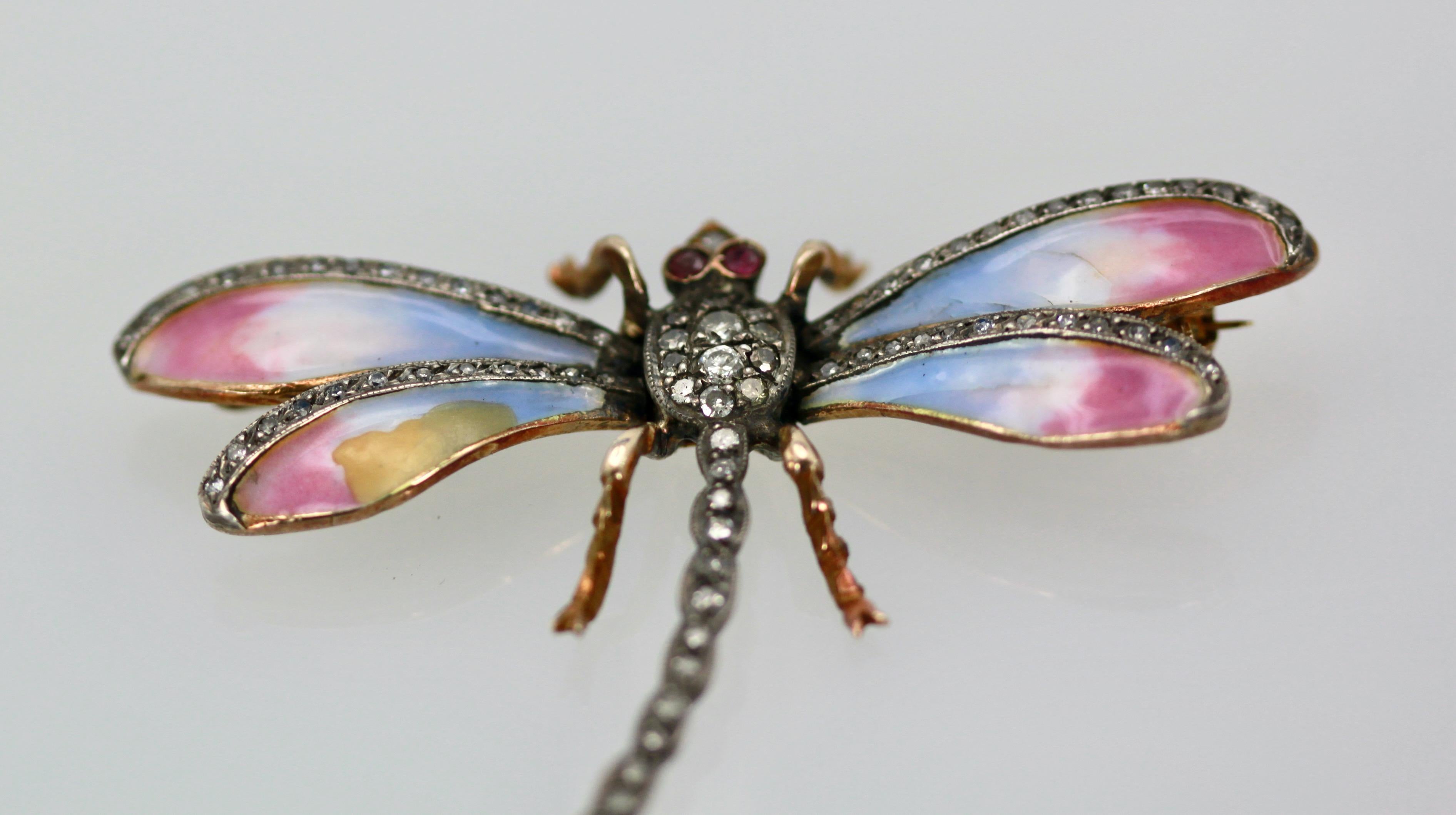This sweet butterfly has pastel colors of blue pink and a bit of yellow.  This pin is old a Retro piece circa 1940.  The thorax of this enamel Butterfly is all  Diamonds and the tail is Diamonds as are the top of the wings.  Two Ruby eyes, complete