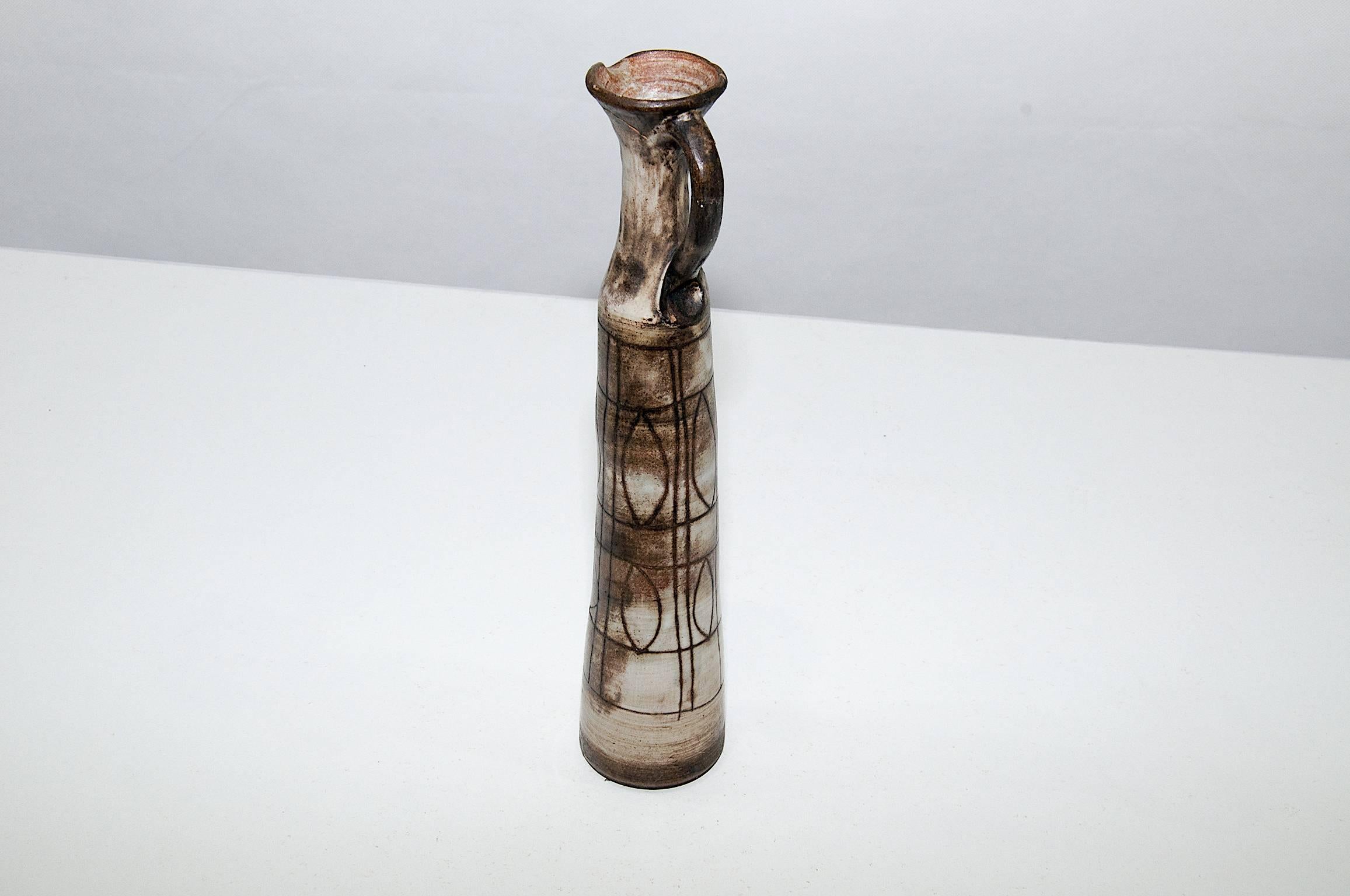 This vase has been designed by Jacques Pourchain in the 1950s-1960s.
Jacques Pouchain was a famous Ceramist in south of France, in Dieulefit.
The techniques used by the artist, is with Sgraffito motifs, done in enameled overlay in a white color,