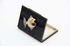 Enamel-covered silver cigarette case with fish on the lid