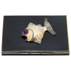 Enamel-covered silver cigarette case with fish on the lid