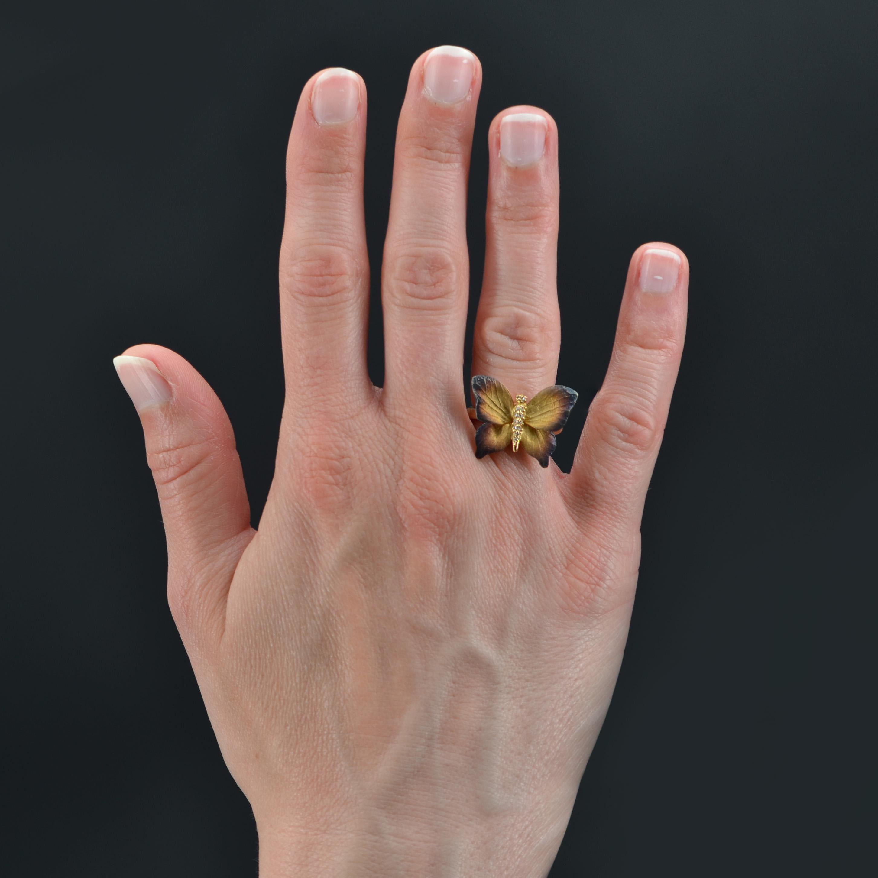 Ring in 18 carat yellow gold.. 
In the form of a butterfly in flight, the wings are of lightly sparkling enamel changing from yellow at the centre to pink then blue at the edges. The entire body of the butterfly is covered with diamonds.
Length: 1.8