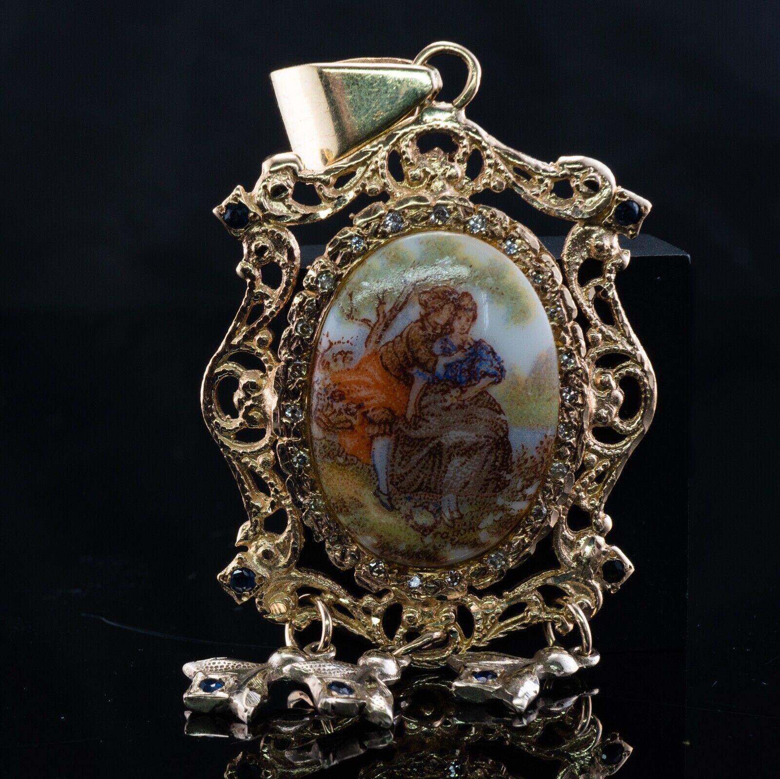 Colgante Camafeo Esmalte Diamante Zafiro Oro 14K Vintage

Este precioso colgante vintage está fabricado en oro amarillo macizo de 14 quilates. Está engastado con un camafeo de esmalte en el centro, zafiros naturales y diamantes. 
El camafeo mide 2,5