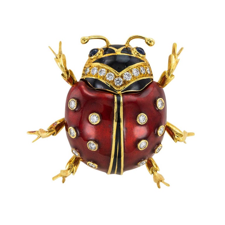 Enamel diamond and sapphire ladybug figural gold brooch circa 1960.

We are here to connect you with beautiful and affordable antique and estate jewelry.

SPECIFICATIONS:

DIAMONDS:  twenty-one round brilliant-cut diamonds totaling approximately
