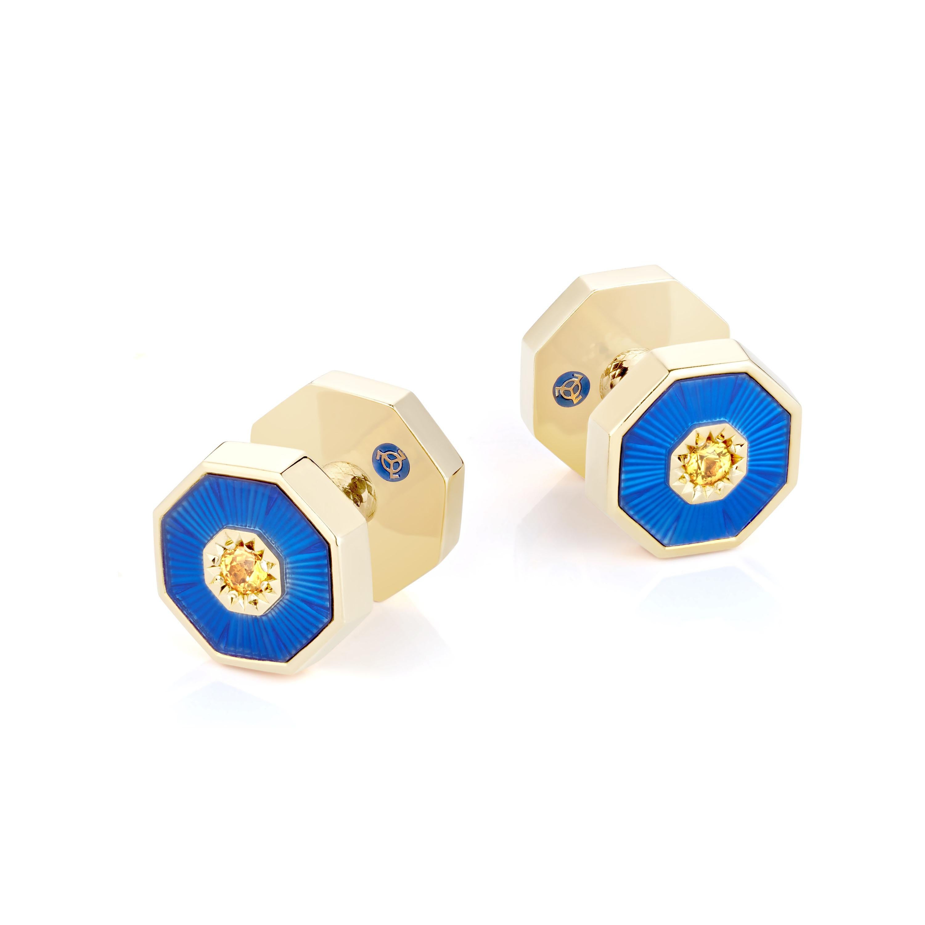 These luxurious 18K solid gold cufflinks are double-sided, set with natural yellow sapphires, and finished with royal blue guilloche enamel. Two parts connect to each other via a screw mechanism. Dome elements remind of the splendorous and geometric