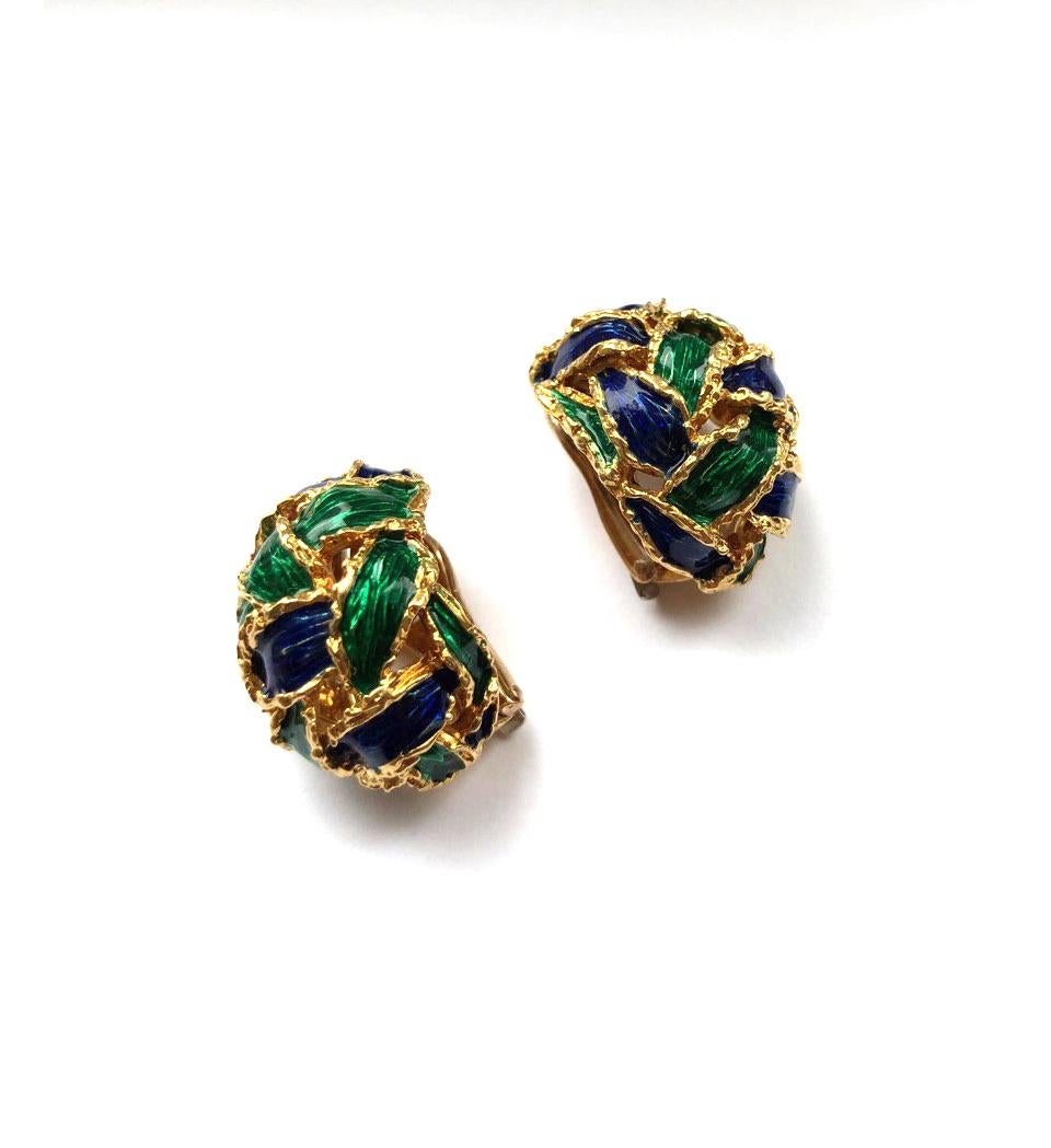 stamped 'Kutchinsky' and '18'.
18k yellow gold with green and blue enamel highlights.
woven bombé form.
