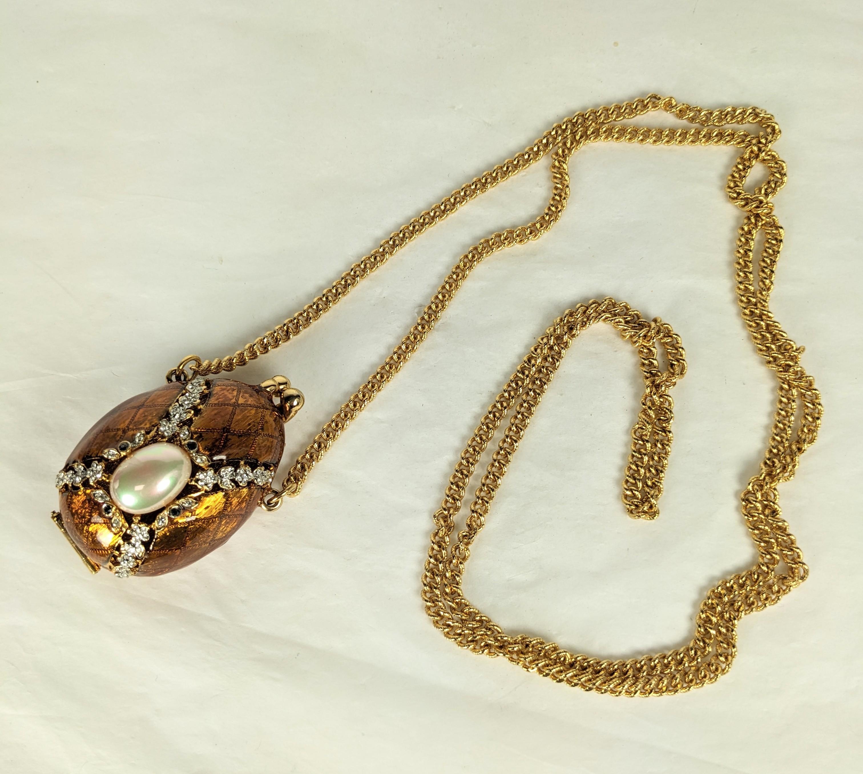 Enamel Faberge Easter egg pendant purse locket from the 1990's. Enamel in tones of brown copper with crystal and jet pastes. Can be worn crossbody as well. Egg 2.5