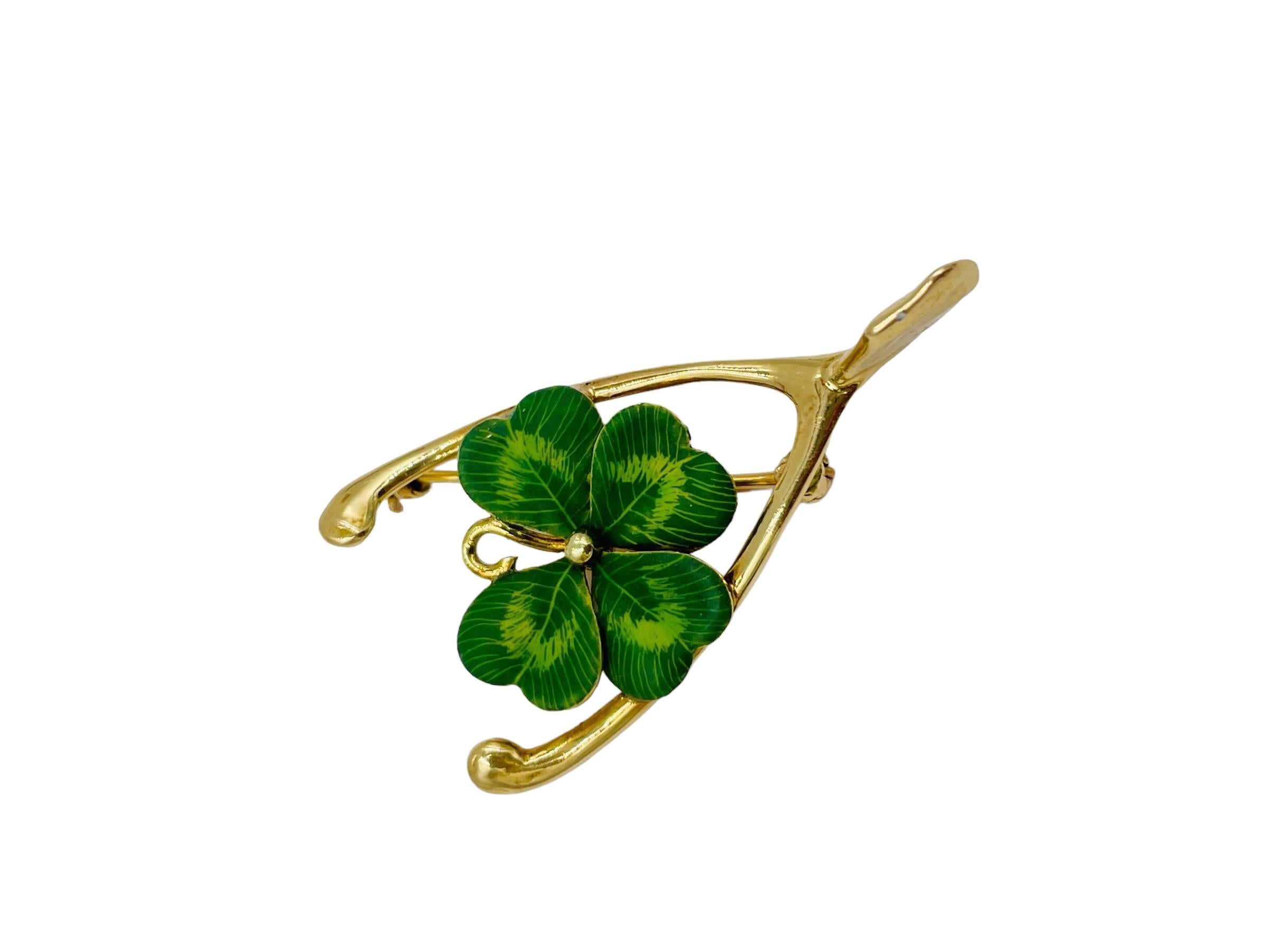 Enamel 4 Leaf Clover Wishbone yellow gold brooch, ca 1910.

SPECIFICATIONS:  P-DJ812I   What a great good luck charm!!!  Enamel in great condition.

METAL: 14k yellow gold

DIMENSIONS: 1-5/8” X 13/16”

WEIGHT: 5.6 grams 

CONDITION: high