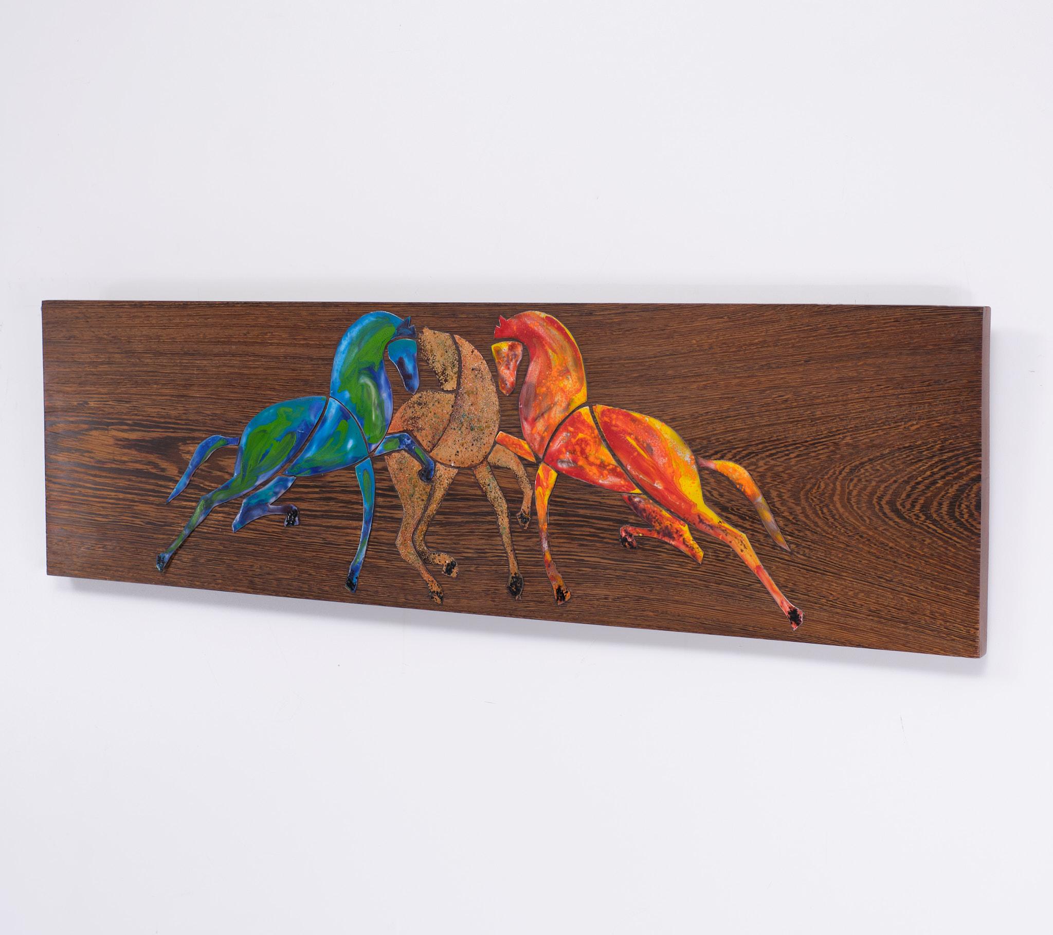 Enamel Horses in many colors , on a Thick Wénge panel . Love the movement 
in the Horses . Attributed to Julia F.M.T. Braendle (1929-1982). 
Background information.
Juliana Francisca Maria Tosco Braendle (Brändle) was born on 28 August 1929 in
