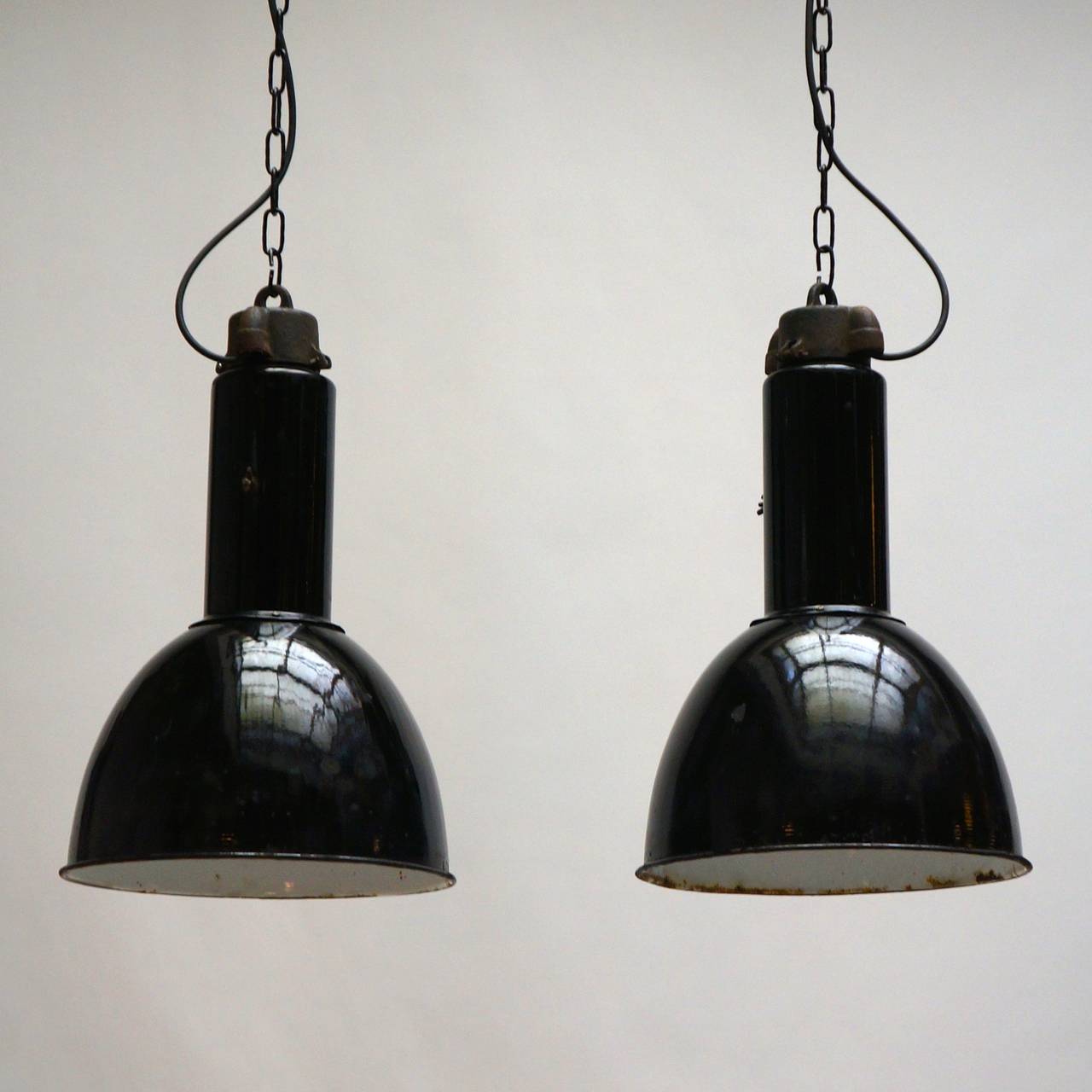 Two very similar Industrial factory pendant lights, in black enameled steel. Wired and ready to be hung.
Measures: Diameter 36 cm.
Height 55 cm.
Total height with the chain is 100 cm.