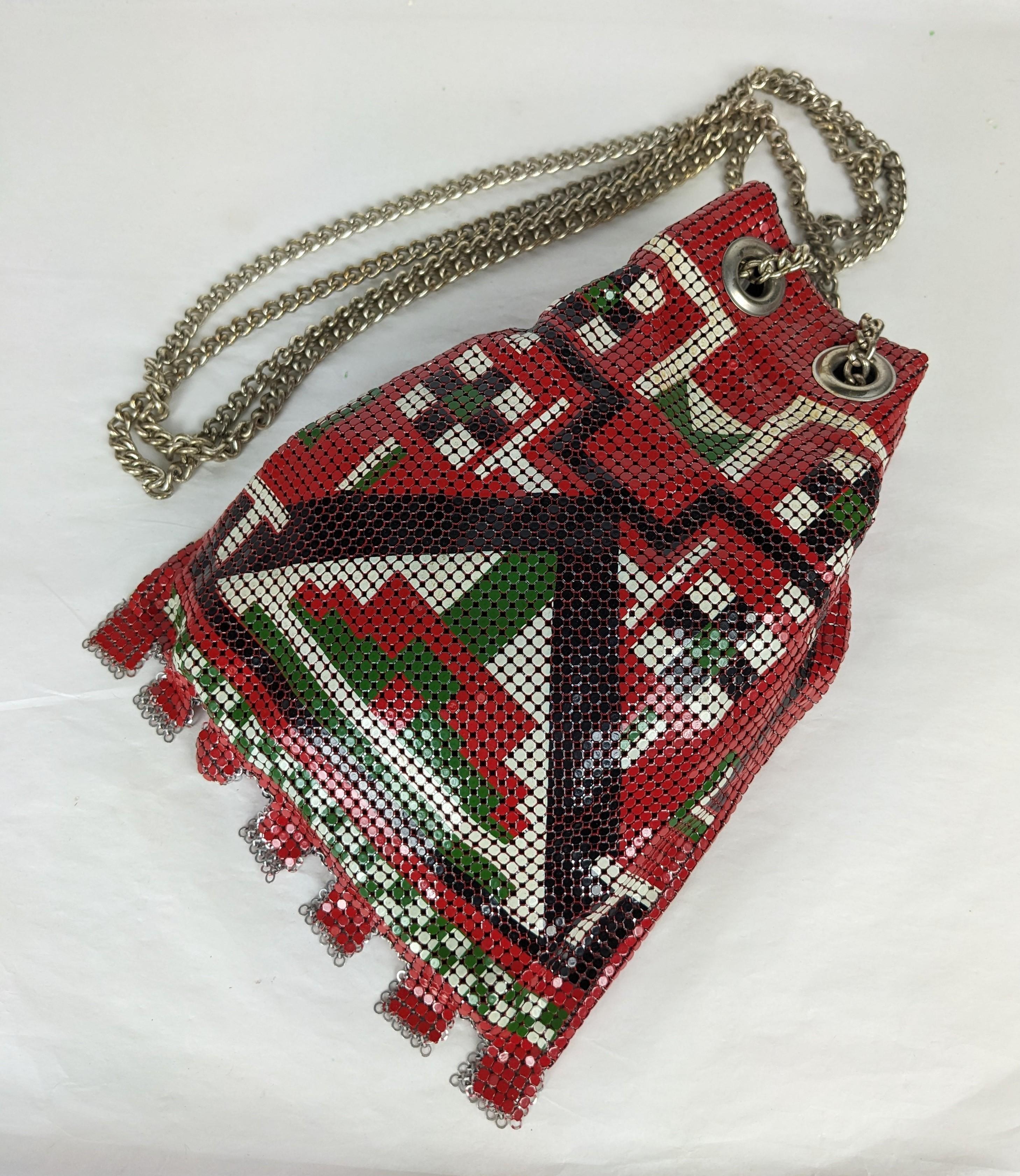 Enamel Metal Mesh Shoulder Bag made probably by Whiting Davis in the 1970's. Enamel in Deco style motifs in red, olive, white and black throughout. Drawstring chain with black lining. 
9