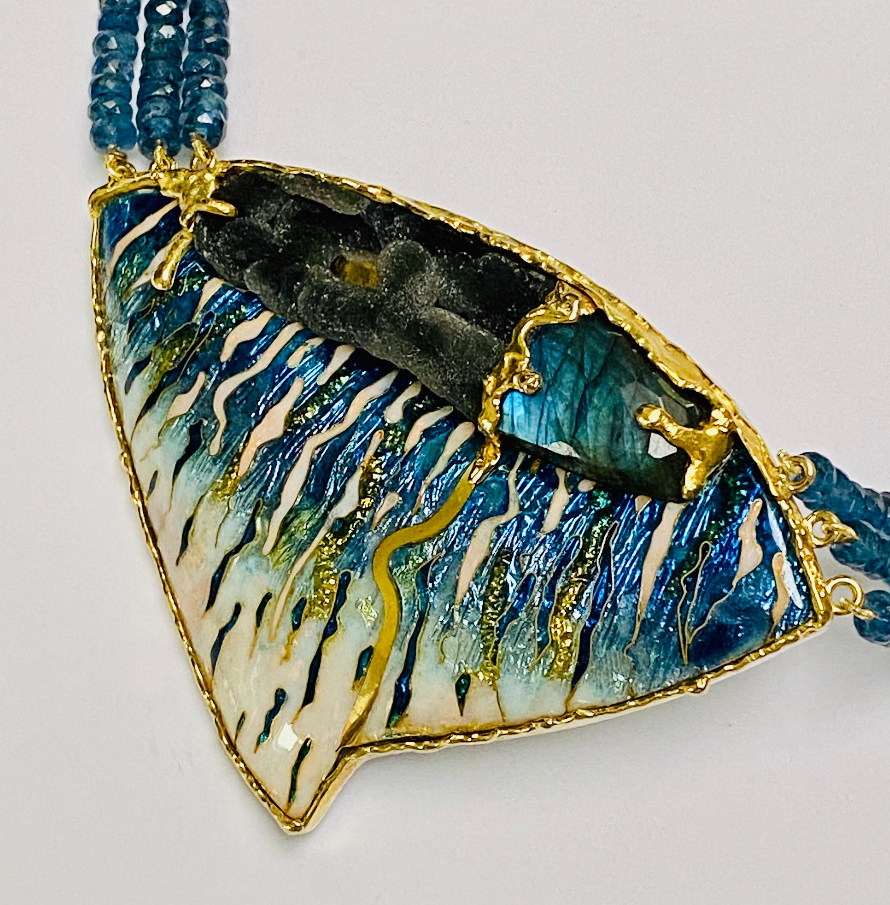 A very unusual contemporary choker necklace is a one-of-a-kind hand made piece of jewellery. The centrepiece is of cloisonné enamel embellished with a distinctive piece of druzy quartz and labradorite. Debbie uses the enamel, gold and stones to