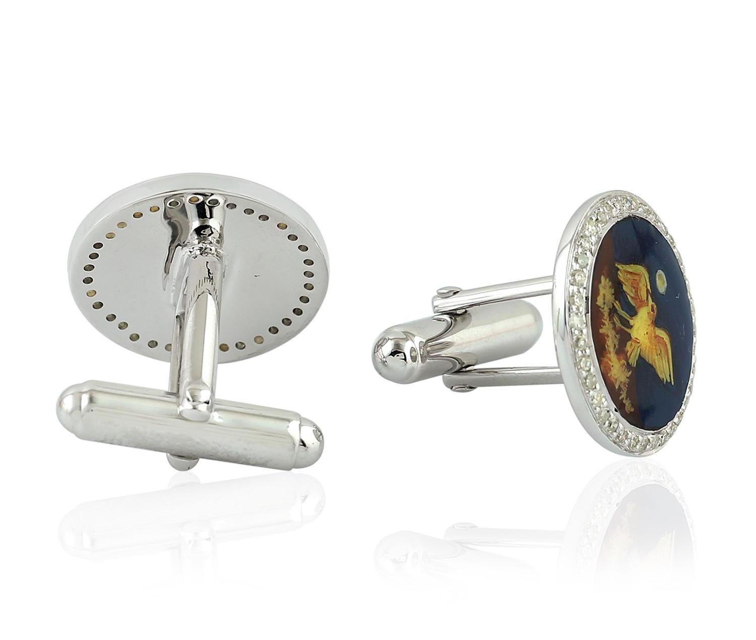 Cast from sterling silver, these enamel cuff links are hand set with .61 carats of pave diamonds with hand painted miniature art of Nightingale bird.

FOLLOW  MEGHNA JEWELS storefront to view the latest collection & exclusive pieces.  Meghna Jewels