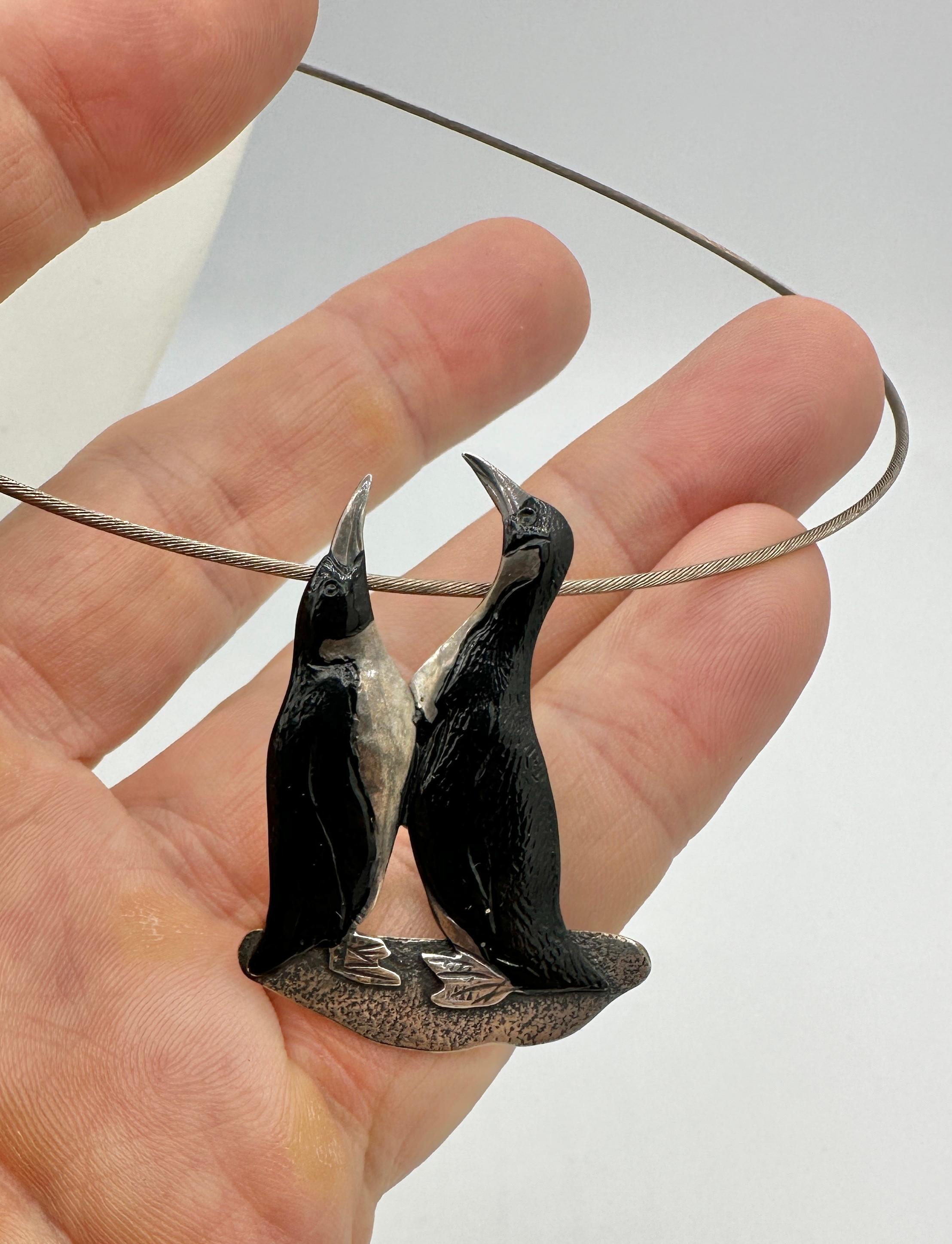 This is a stunning Penguin Necklace or Brooch with two Penguins in silver with gorgeous black enamel adornment.   The Mid-Century Modernist Drop pendant in Silver hangs from a collar necklace.  The pendant may also be removed to be worn as a brooch