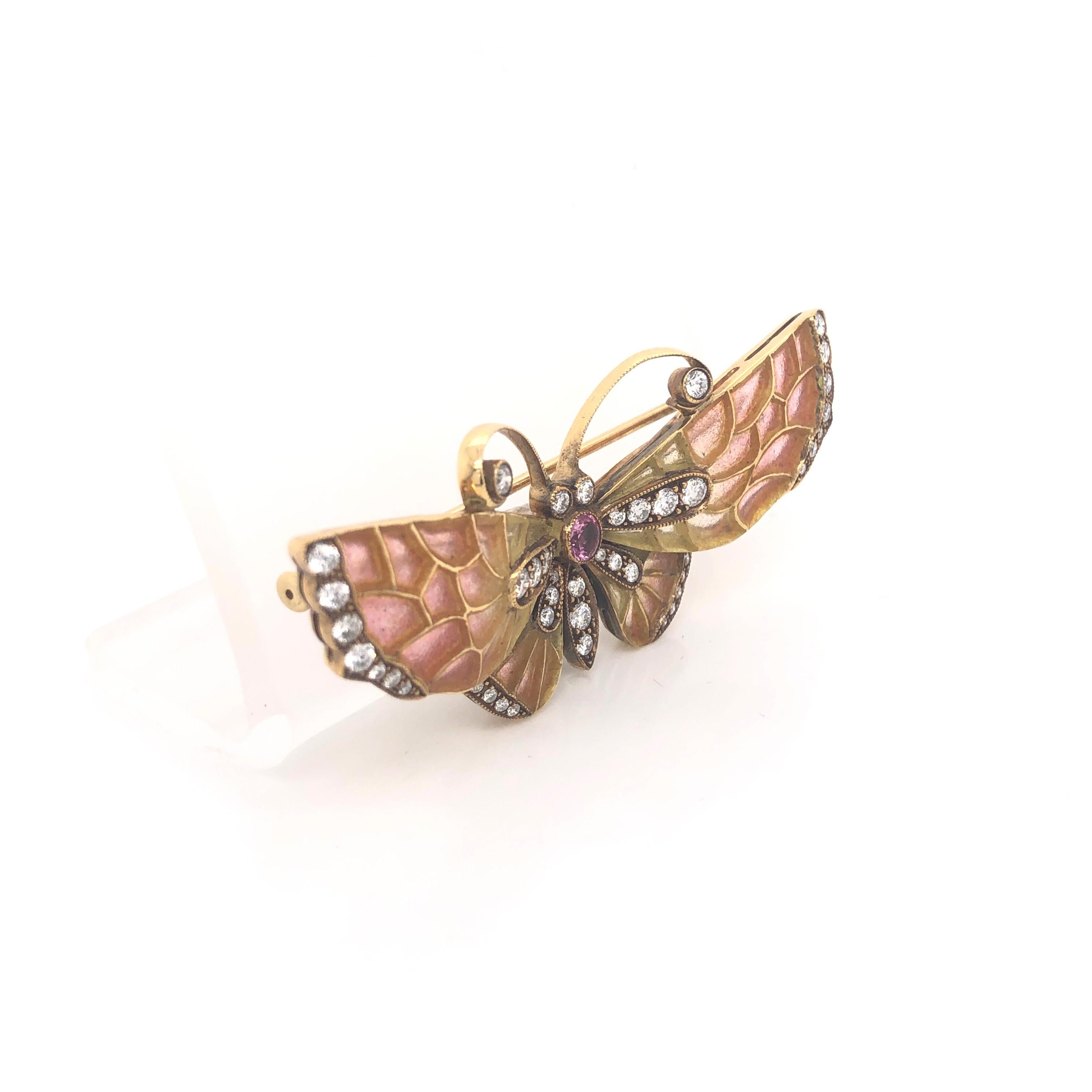 Enamel and diamond butterfly brooch, the plique a jour enamel set wings ranging from red-orange to yellow colour, diamond set detail to the body and wings and a ruby set to the centre, mounted in 18ct yellow gold