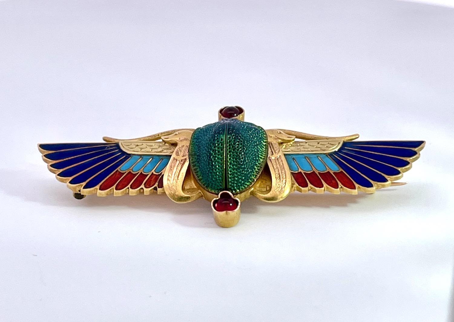 This scarab brooch is by none other than Guiseppe Parvis and it comes out of France.  This brooch is amazing and in perfect condition.  It is 5cm long and 2cm wide and weighs 6.75 grams.  The center is an iridescent real beetle with a bezel set