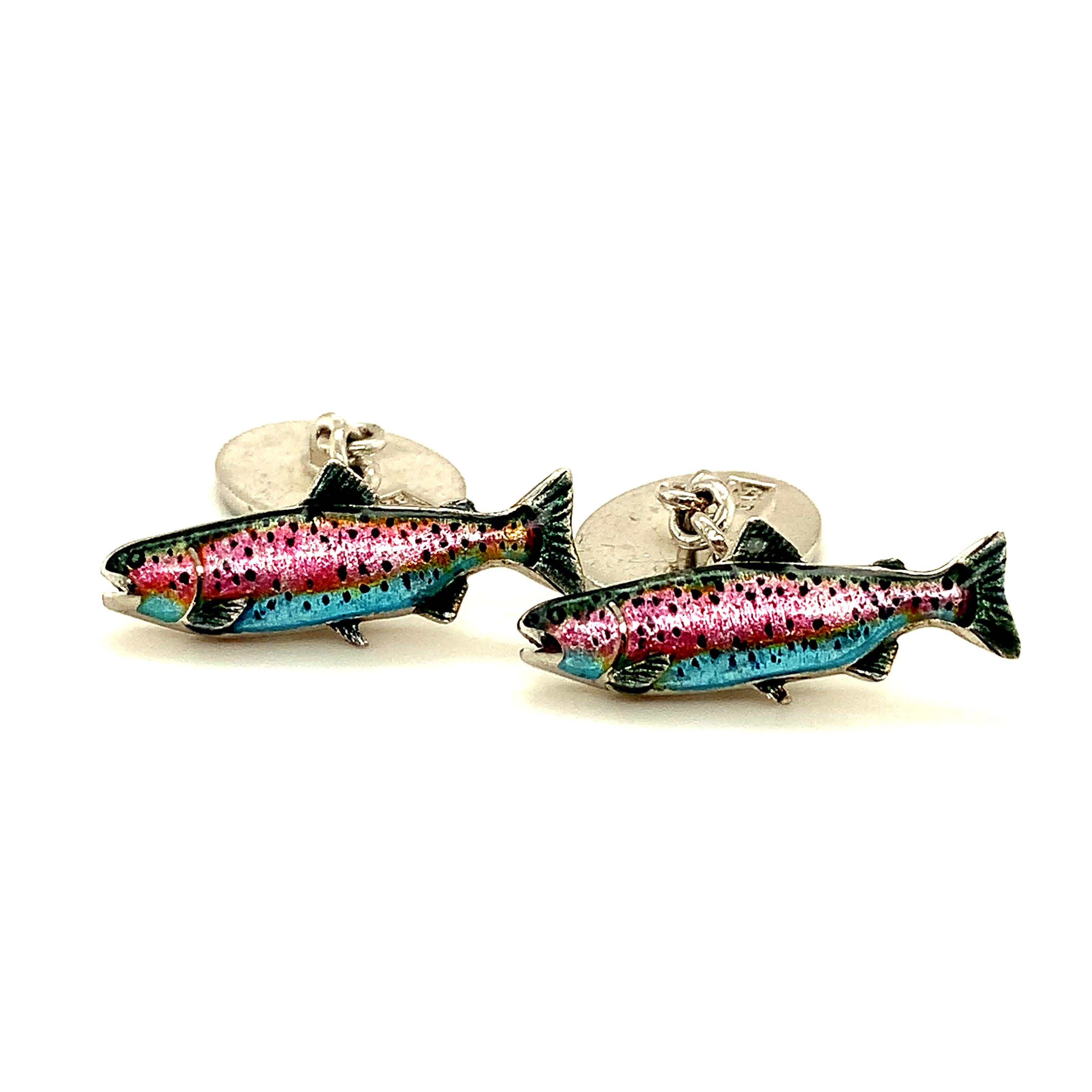 Bright and festive sterling silver cufflinks.  The front is an enamel figural 