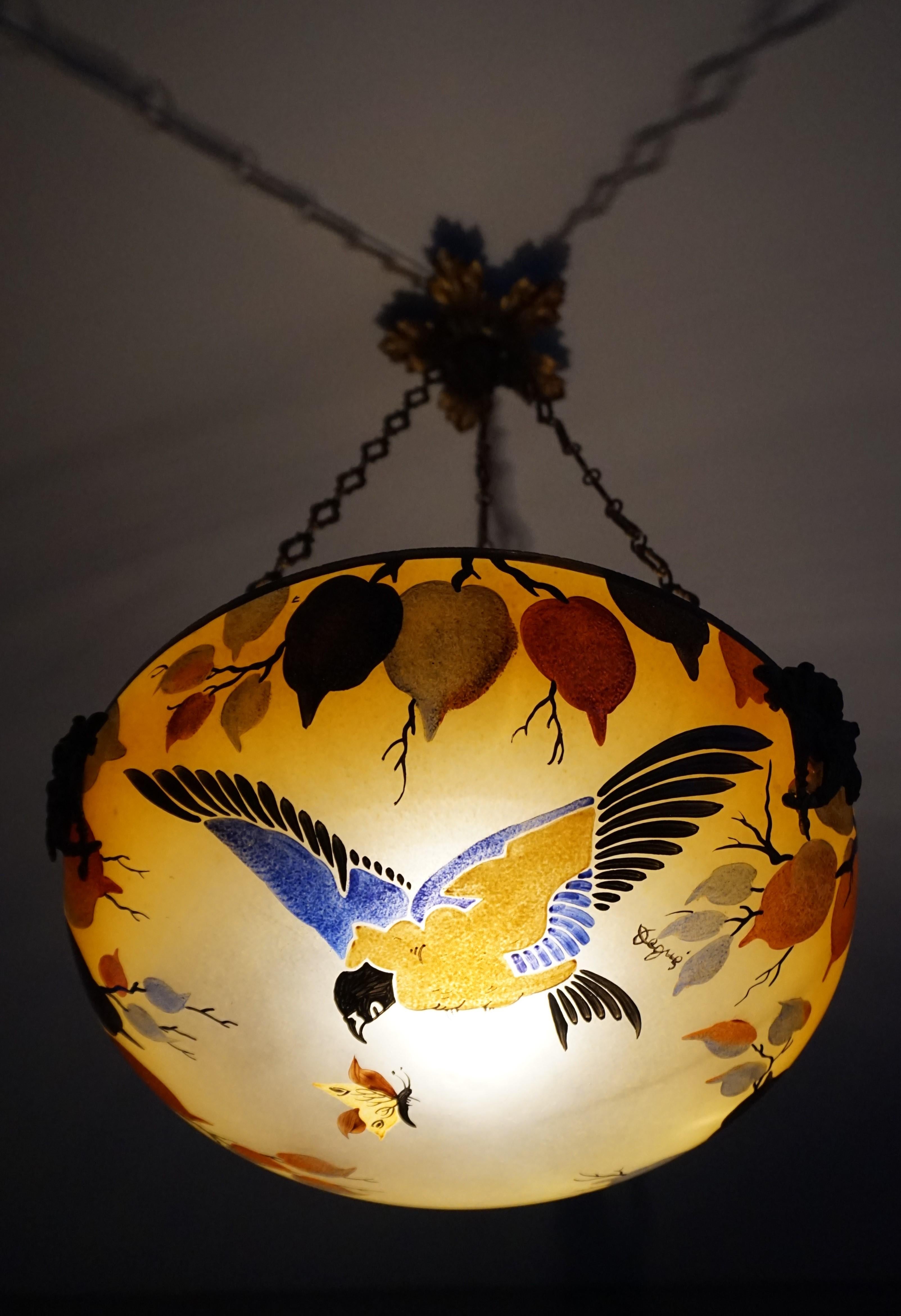Rare and stunning work of lighting art by David Gueron a.k.a. Degué.

If you are passionate about early 20th century decorative art then you will love this striking pendant. What you are seeing here is a one of a kind, hand painted and enamelled