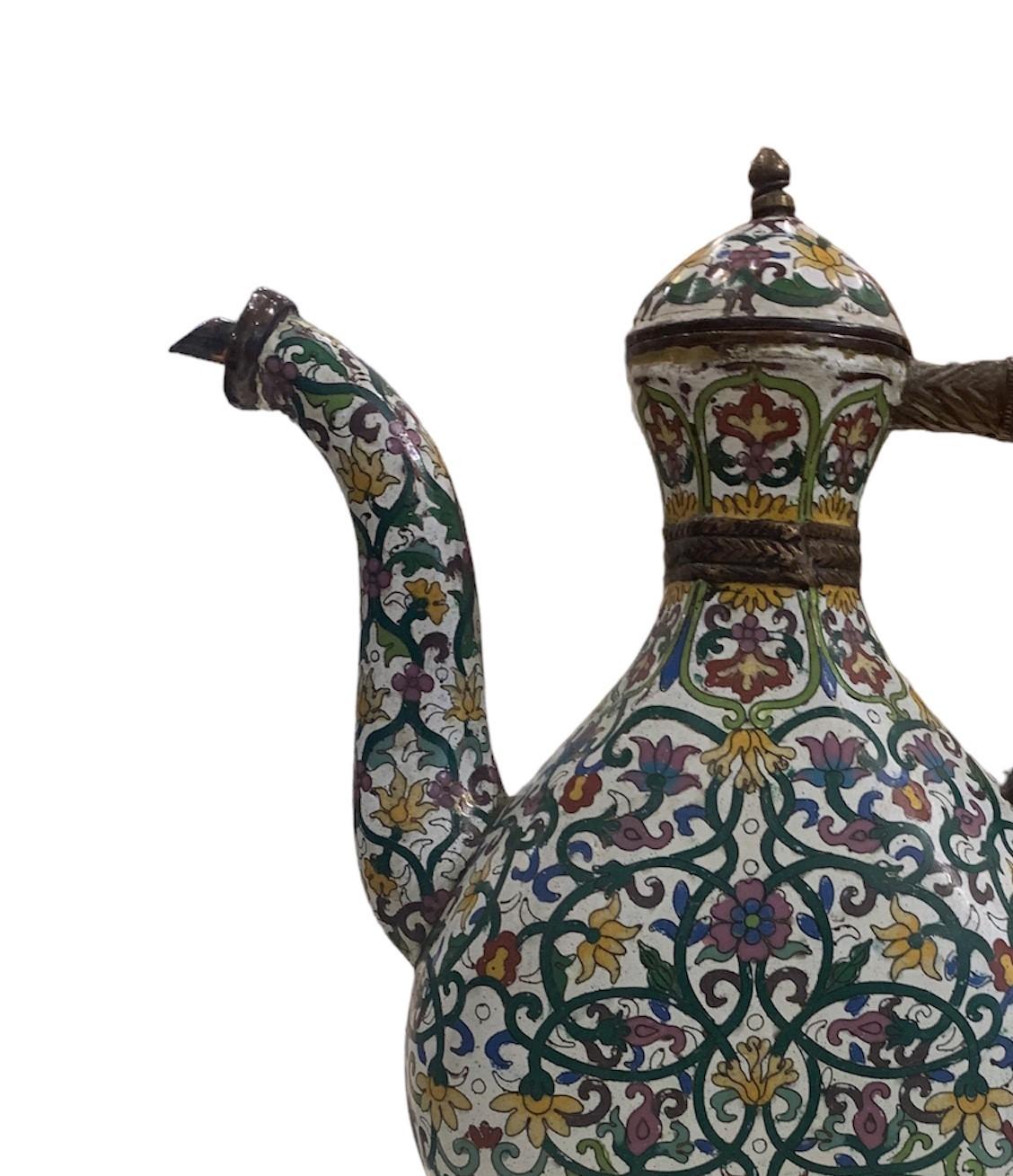The antique brass Mughal ewer is a magnificent piece of art and craftsmanship that reflects the opulence and grandeur of the Mughal Empire. This ewer, originating from the Mughal period, is made primarily of brass, a durable and richly colored metal