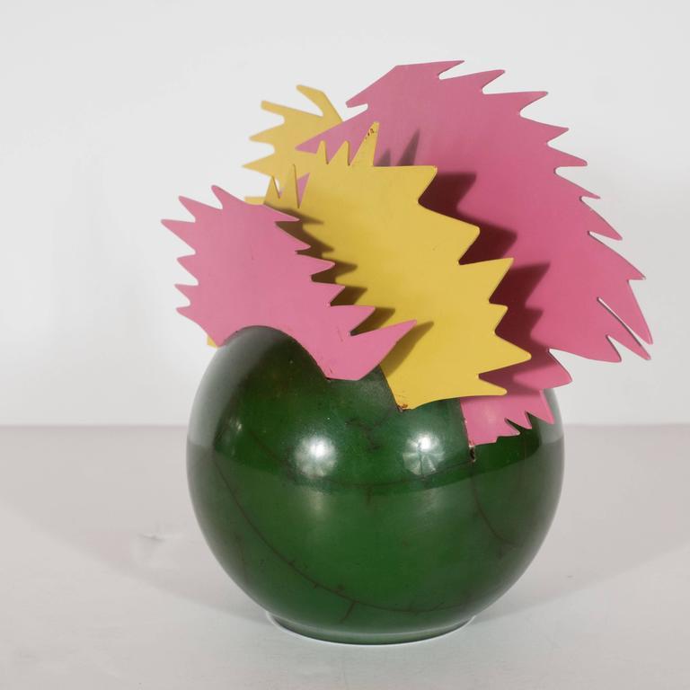 This idiosyncratic and powerful sculpture, with its vibrant color scheme and dynamic form, encapsulates all of the energy of pop on an intimate scale. The enamel green base with black veins (fabricated to resemble marble) evokes a cartoonish bomb,