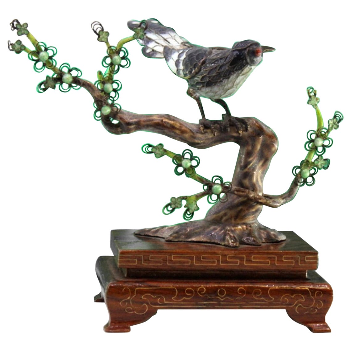 Enameled silver bird perched on a trunk with branches cut out on a wooden base im Angebot