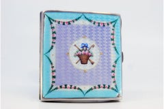 Enameled silver cigarette case with flowers and wavy designs, hinged lid