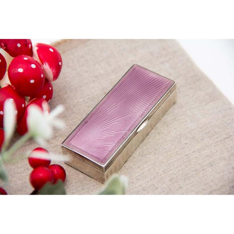 Description: Enameled silver stamp box, gold interior and hinged lid with lined bottom. Metal: Silver . Origin: European. Brand: Unknown. Weight: 64.06 grams . Dimensions: 7.2cmx1.6cm. Content: 833/1000. Assay Mark: Yes. Additional information: Good