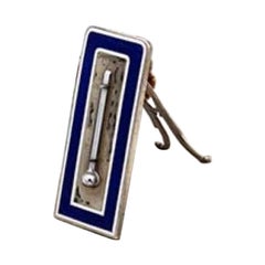 Enameled silver thermometer with engraved cut-out stand