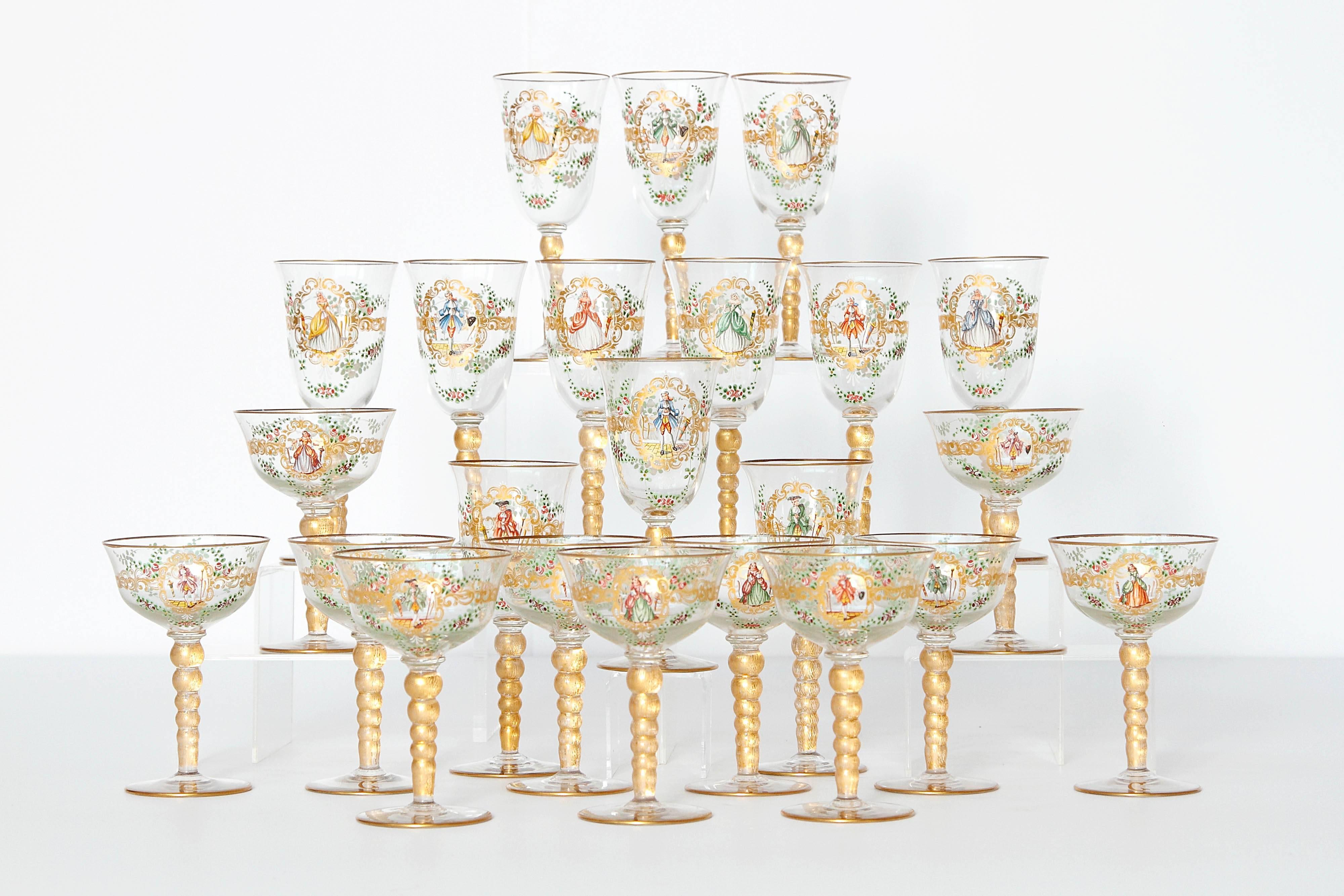 A set of Venetian glass stemware with poly chrome Florentine enamel decoration, a central gold cartouche bearing either a Gentlemen or Lady with white doves, among flowers and swags. Graduated stacked ball stems. Gilt rims and stems. Set of 12 wine