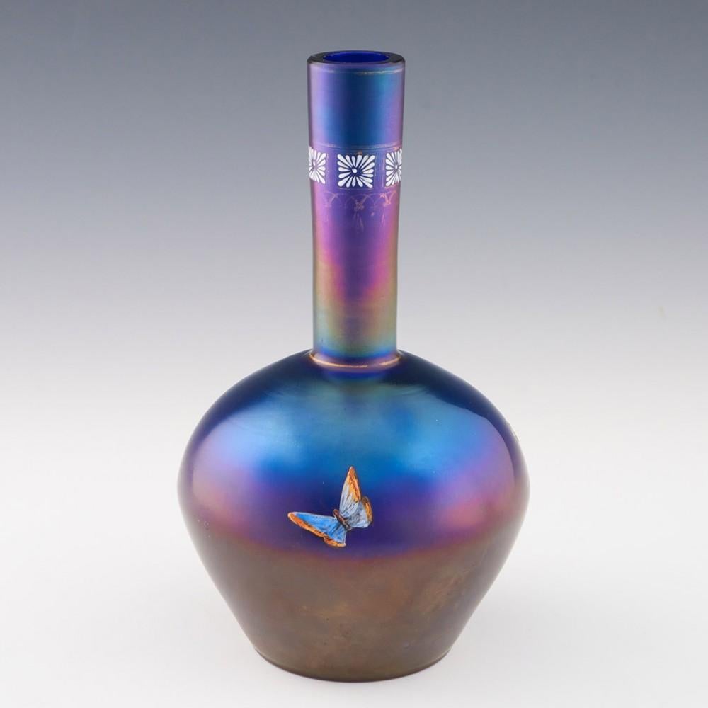 Heading :Early 20th century enamelled iridescent glass vase
Date : Early 20th century
Origin : French or Austrian
Bowl Features : Classically inspired shape in iridescent glass with enamelled stylised floral band and three enamelled insects