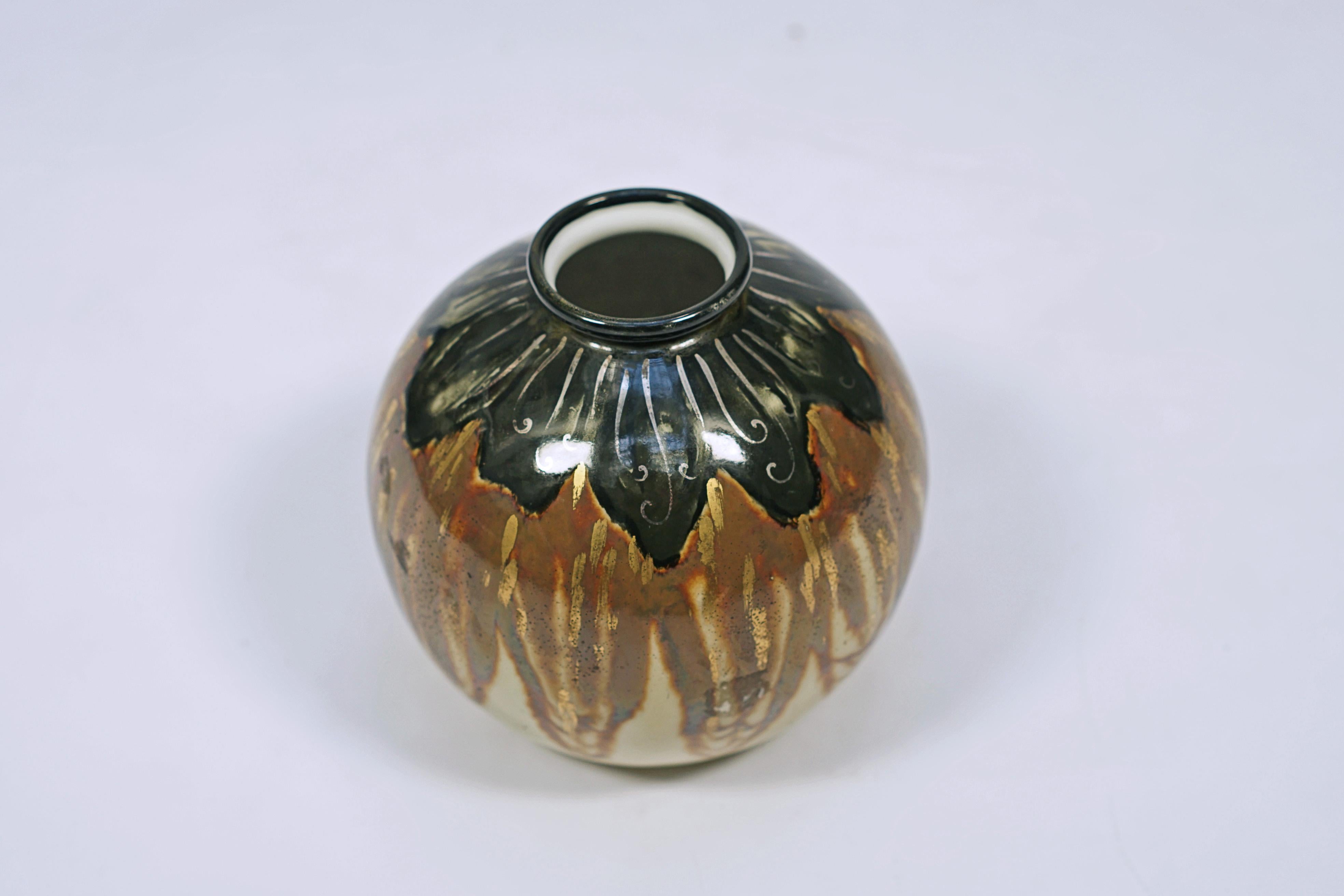 Enamelled porcelain vase in brown tones and black, design by Lemovices, made by Limoges. Signed Lemovices

France, circa 1940.