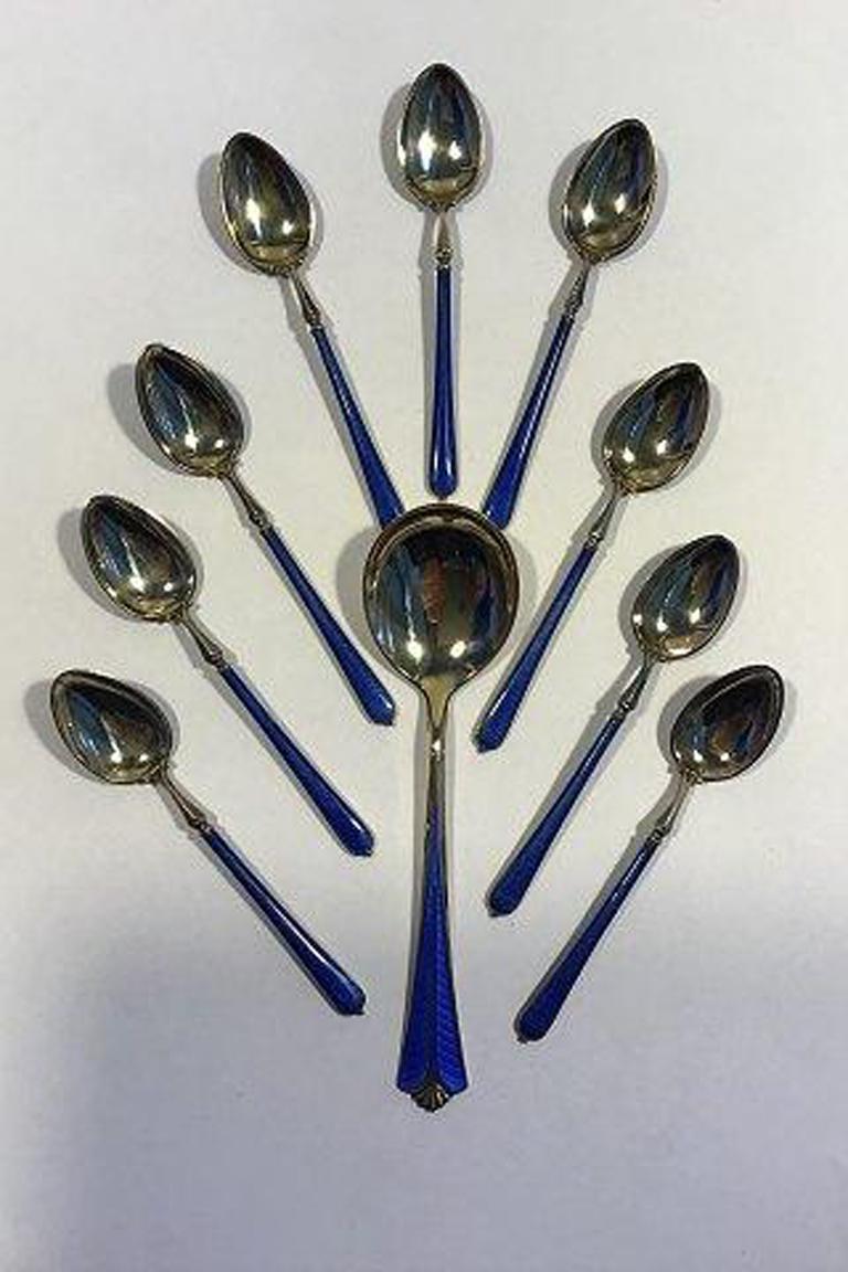 Enamelled sterling silver set of spoons (9+1) 

Measures 9.5 cm & 12.7 cm(3 47/64 in & 5 in).