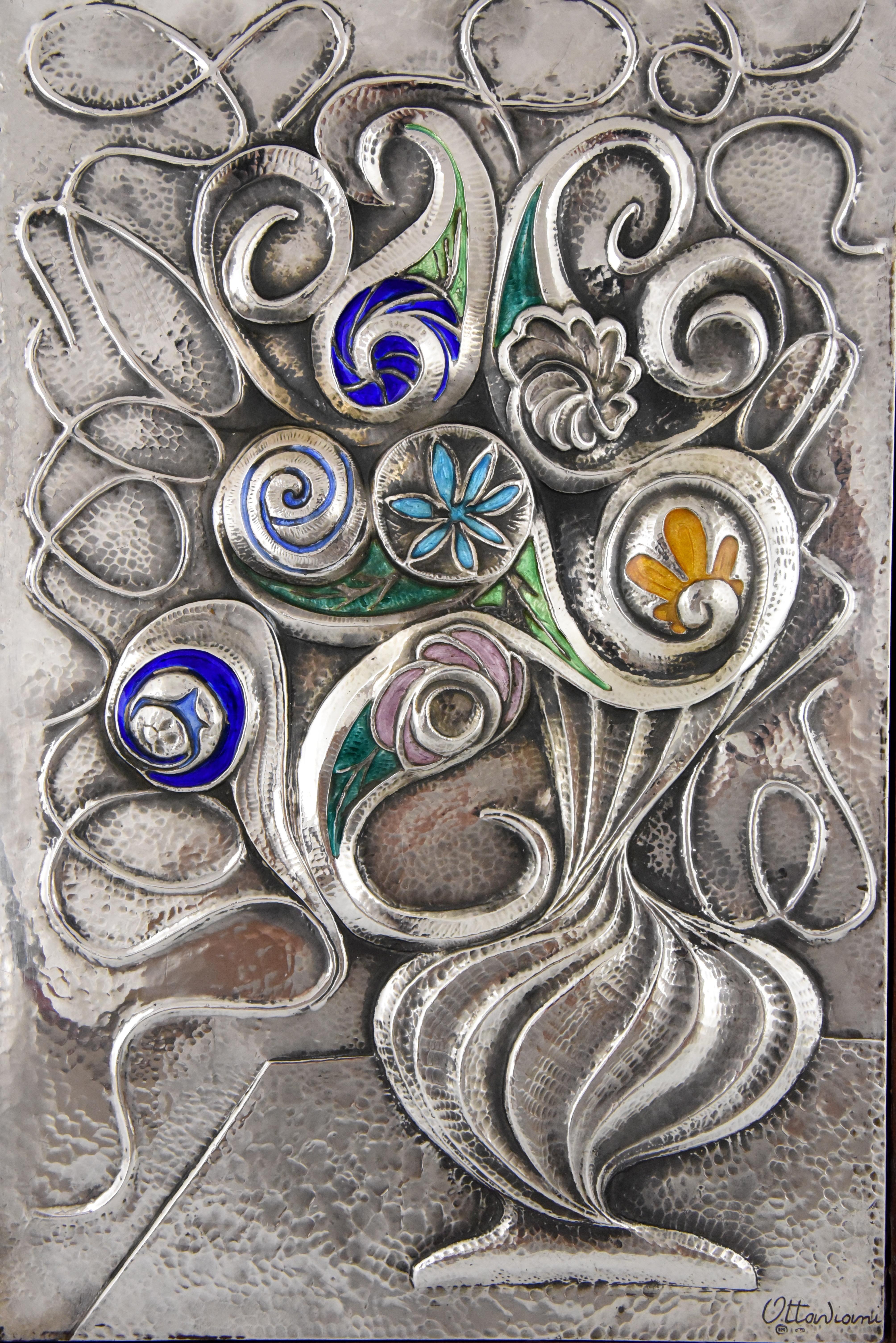 Fine Mid-Century Modern enamelled sterling silver wall decoration by the Italian artist Ottaviani picturing a flower vase in the original wooden frame, circa 1960. Signed and with hallmark.

Ottaviani (1945) is a jewelry and silver firm located in