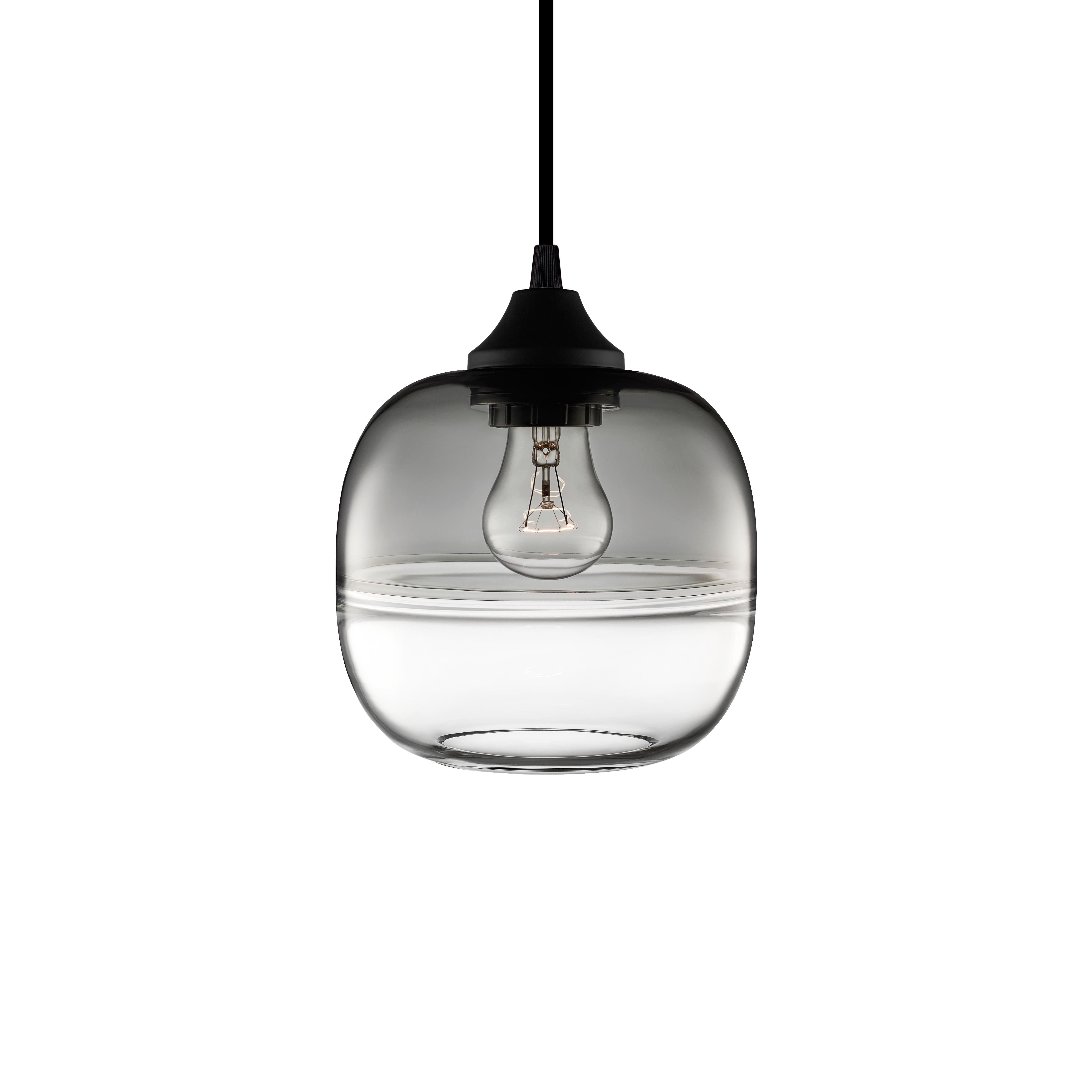 Created by implementing the Venetian technique of fusing two separate entities of glass into one single piece, the Encalmo Grand and Petite celebrates inspired, sensual design. Every single glass pendant light that comes from Niche is handblown by